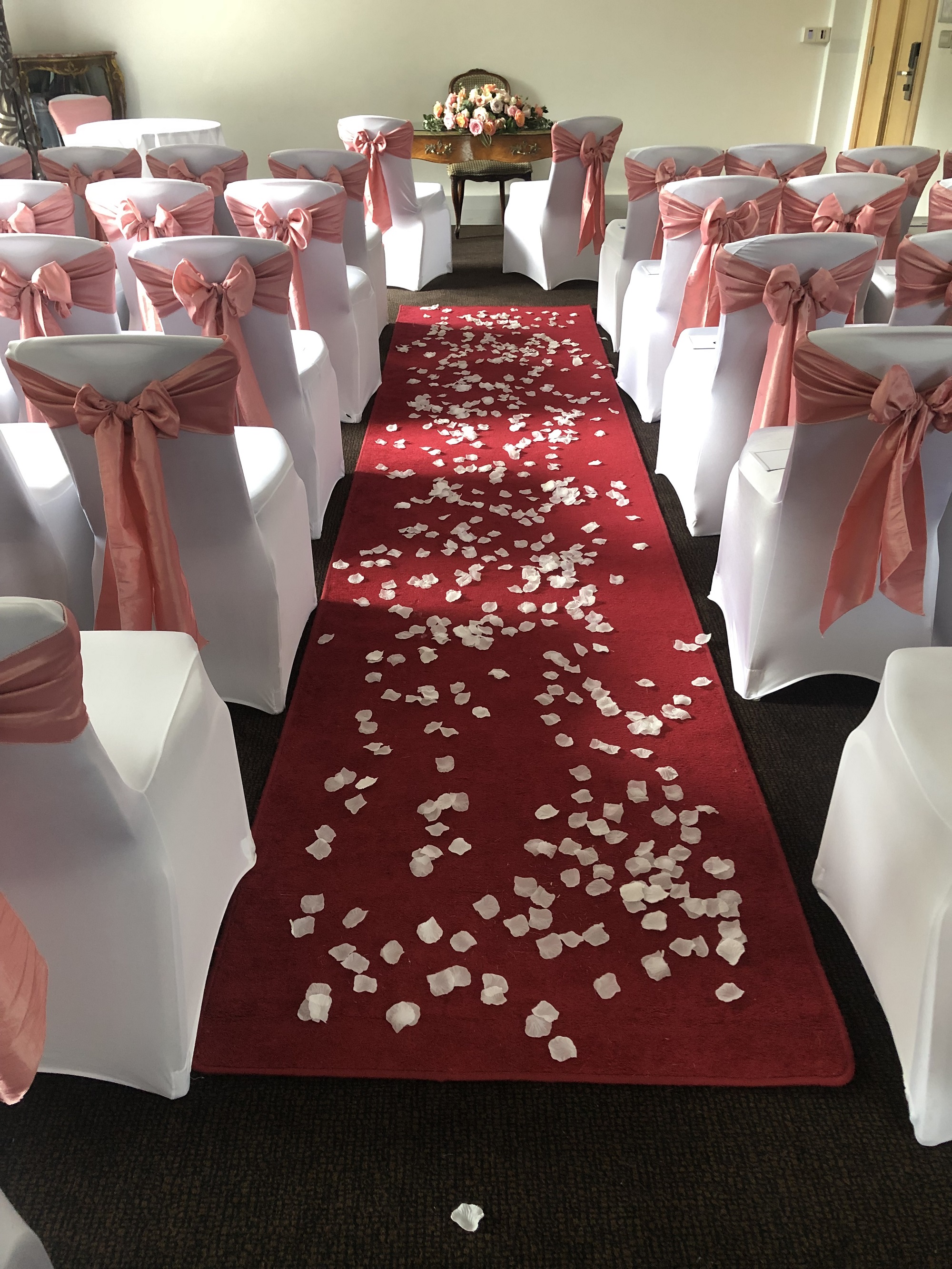 Mortimer Room wedding aisle with red carpet and white rose petals, ideal for ceremonies.