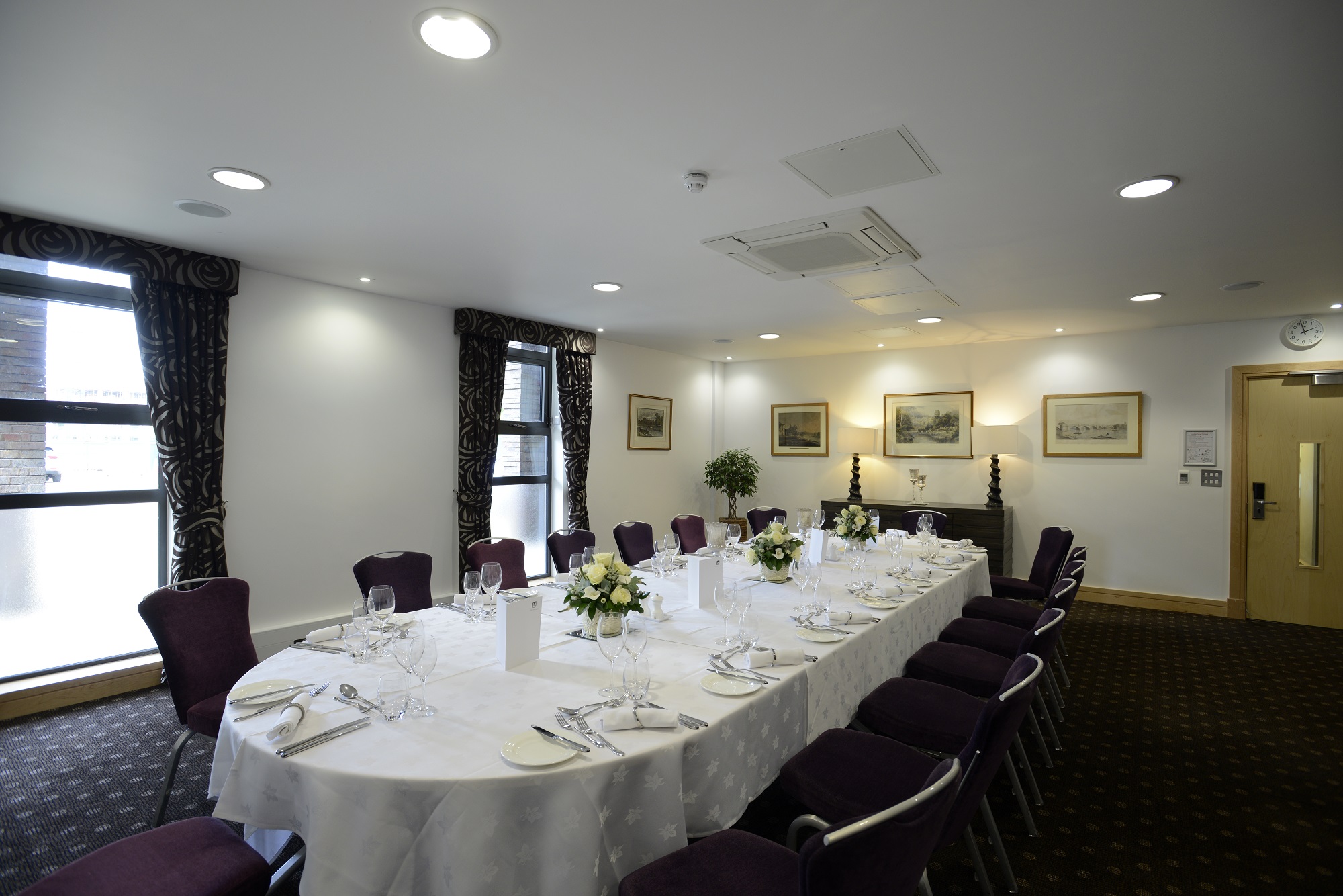 Elegant Lloyd Room dining setup with fine china for corporate events.