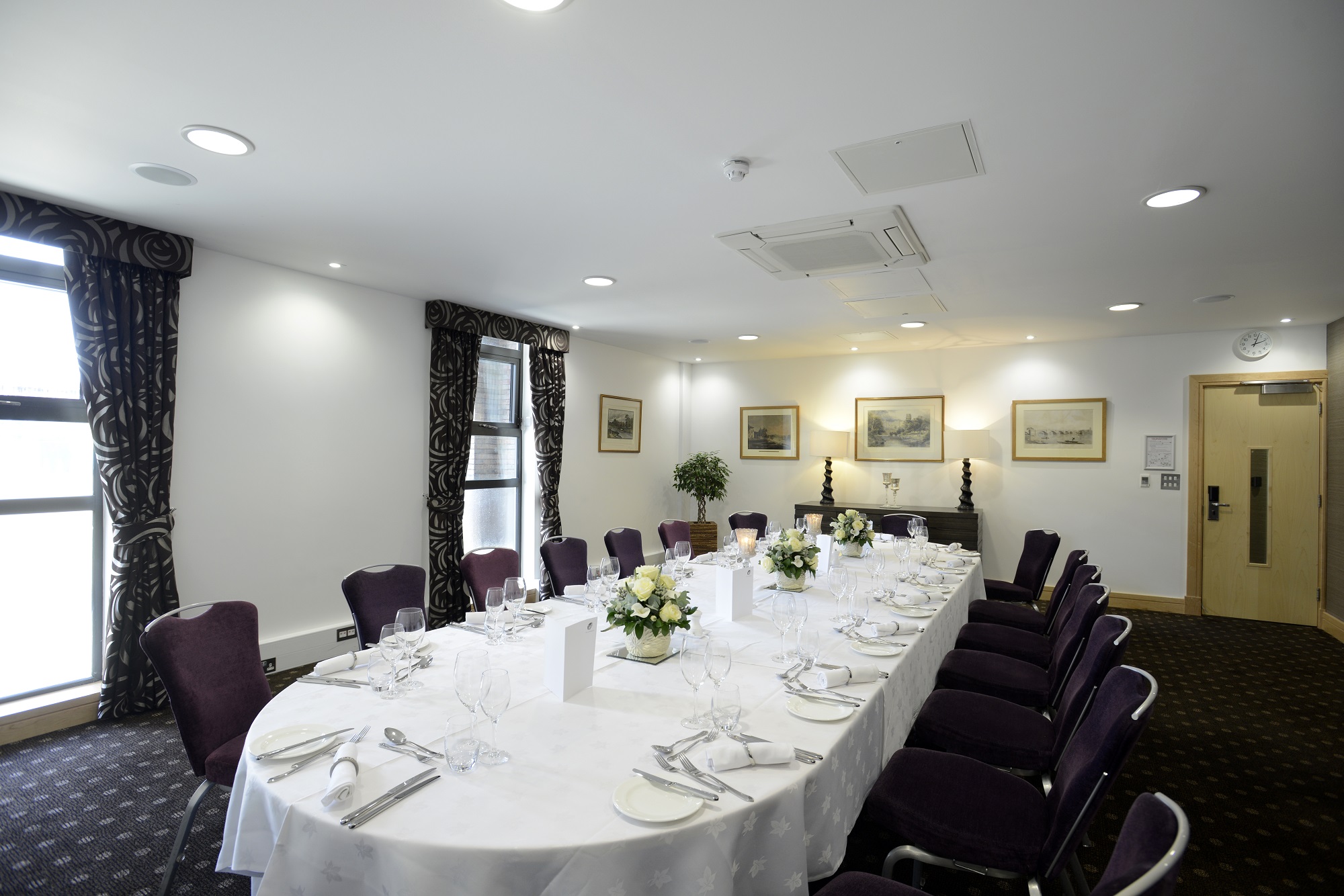 Elegant Lloyd Room meeting space with floral decor for corporate events.
