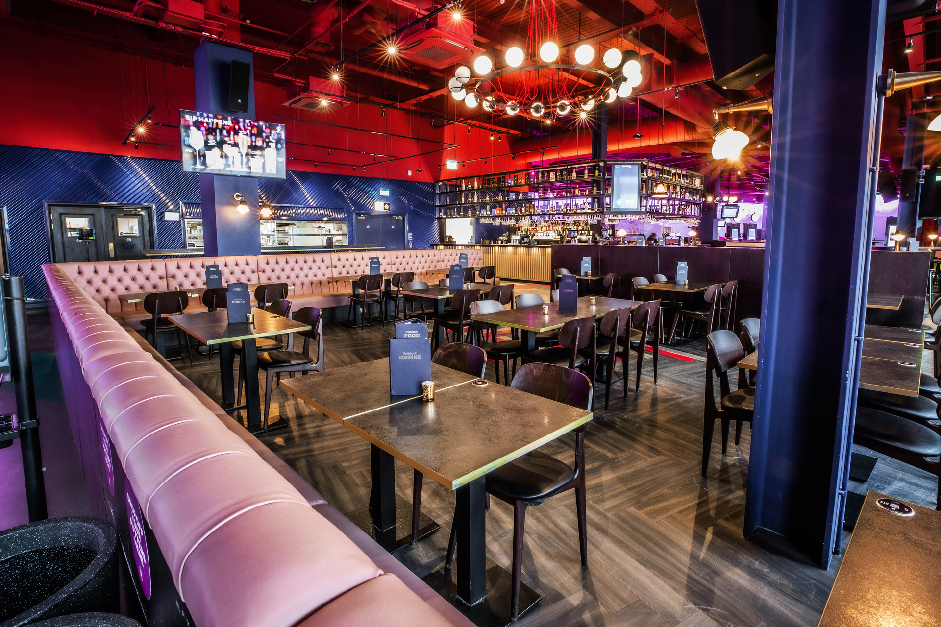 Ruby semi-private event space at Puttshack Lakeside with flexible seating for gatherings.