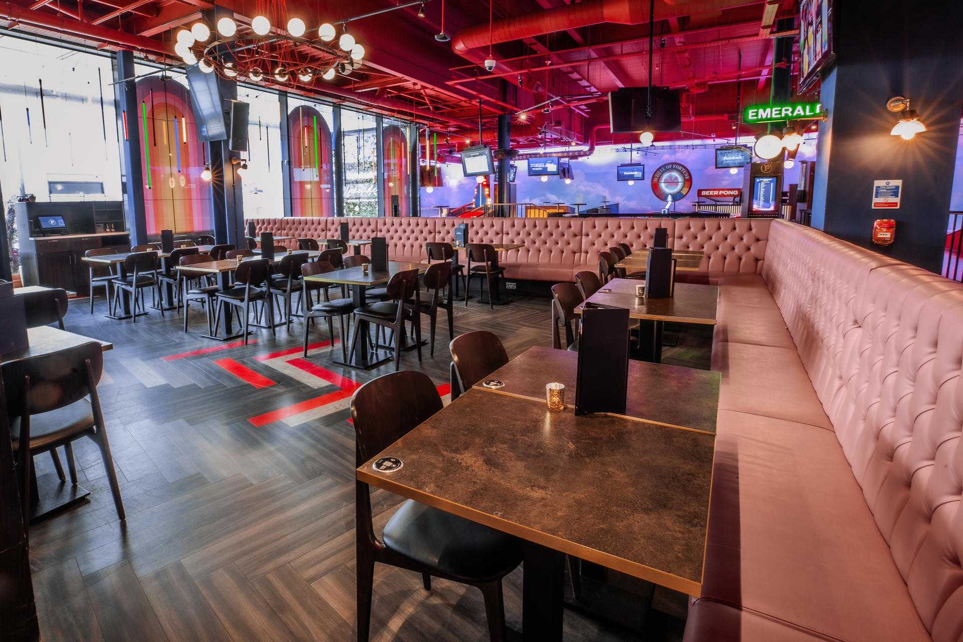 Ruby semi-private dining area at Puttshack Lakeside, perfect for casual meetings and events.