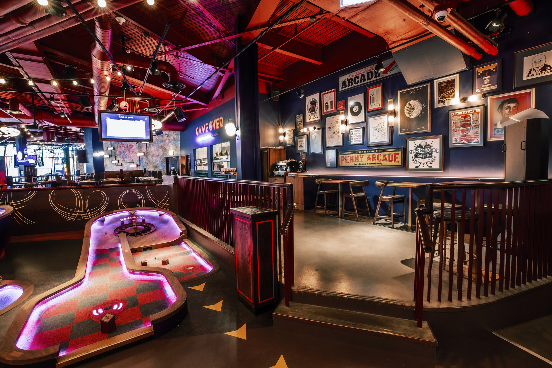 "Vibrant Christmas event space with mini-golf at Puttshack White City for team-building."