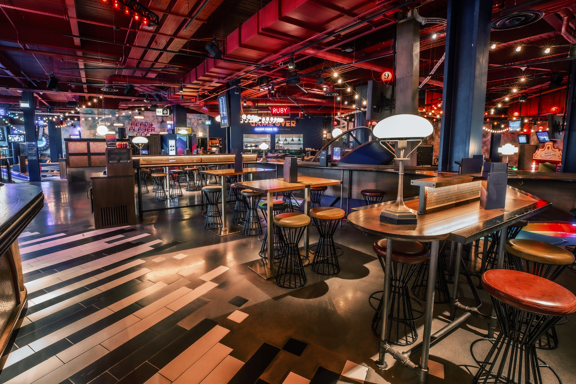 "Vibrant Christmas event space with modern decor at Puttshack White City for gatherings."