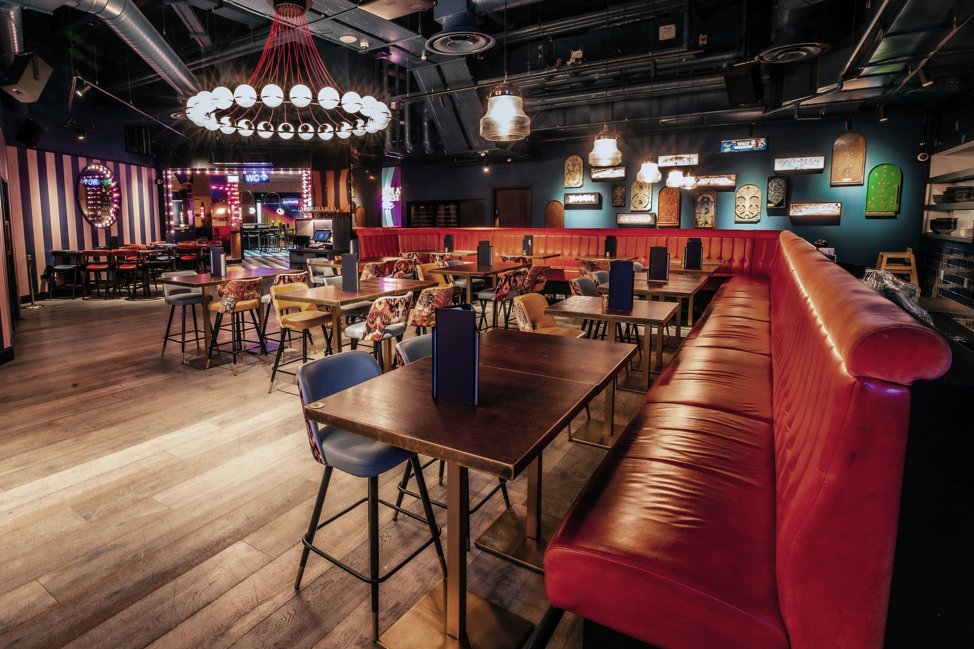 Christmas party at Puttshack Bank with vibrant decor and social seating options.