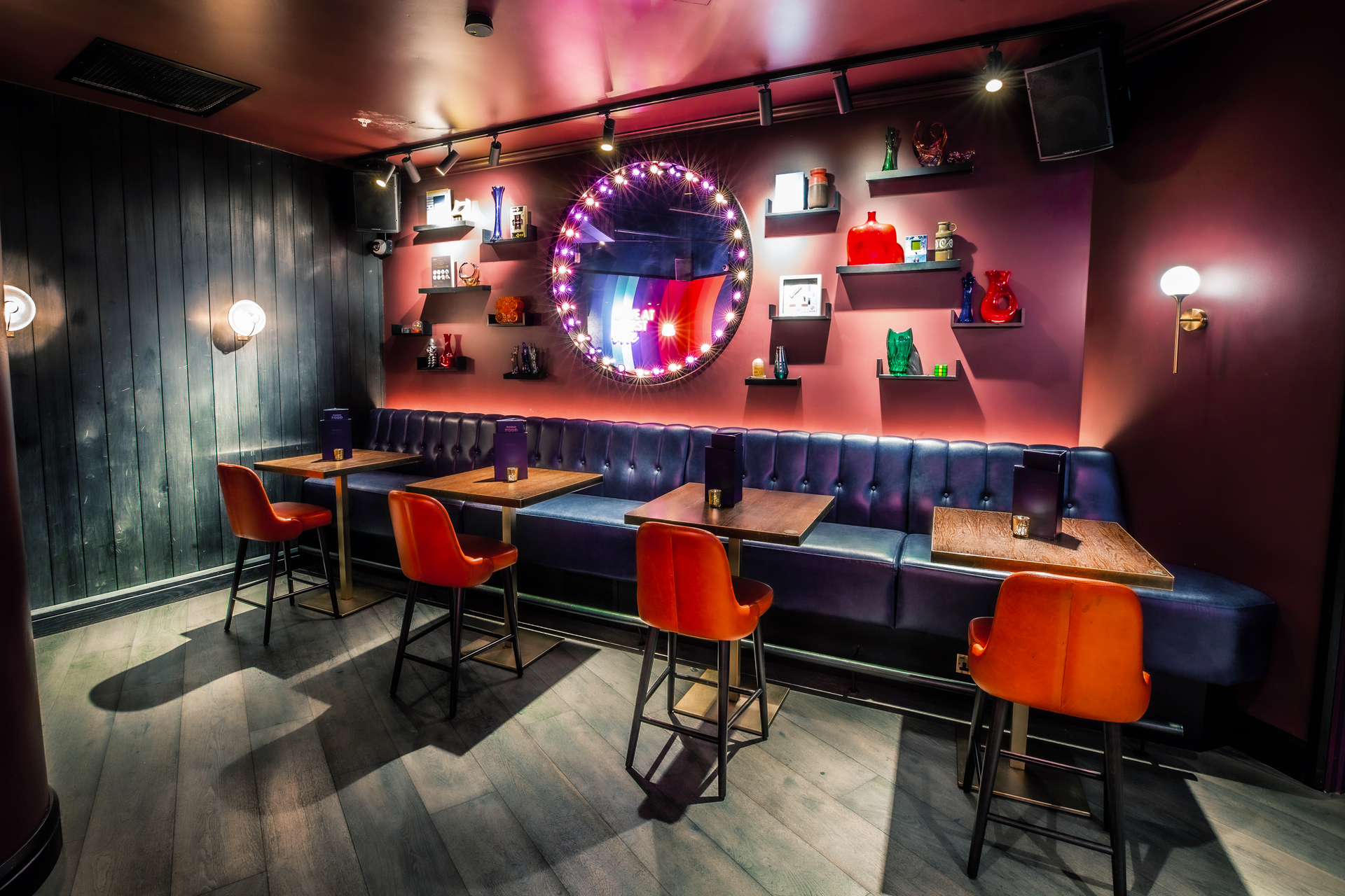 Christmas party at Puttshack Bank with vibrant decor and cozy seating for networking.