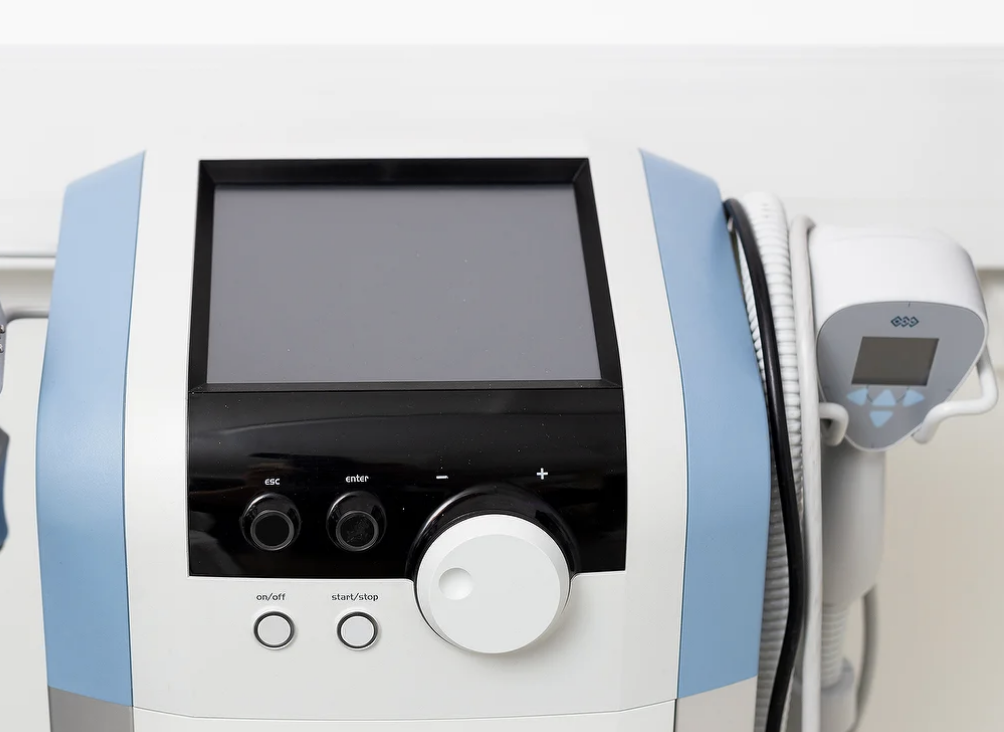 Modern medical device in BelleCell Clinic's consultation room for healthcare conferences.