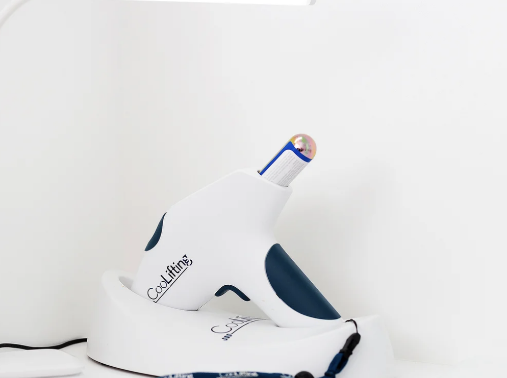 "BelleCell Clinic consultation room with sleek cooling device for spa wellness events."