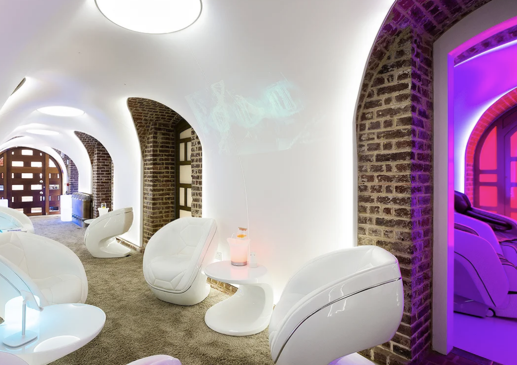 Modern consultation room with curved walls, ideal for wellness retreats and networking events.