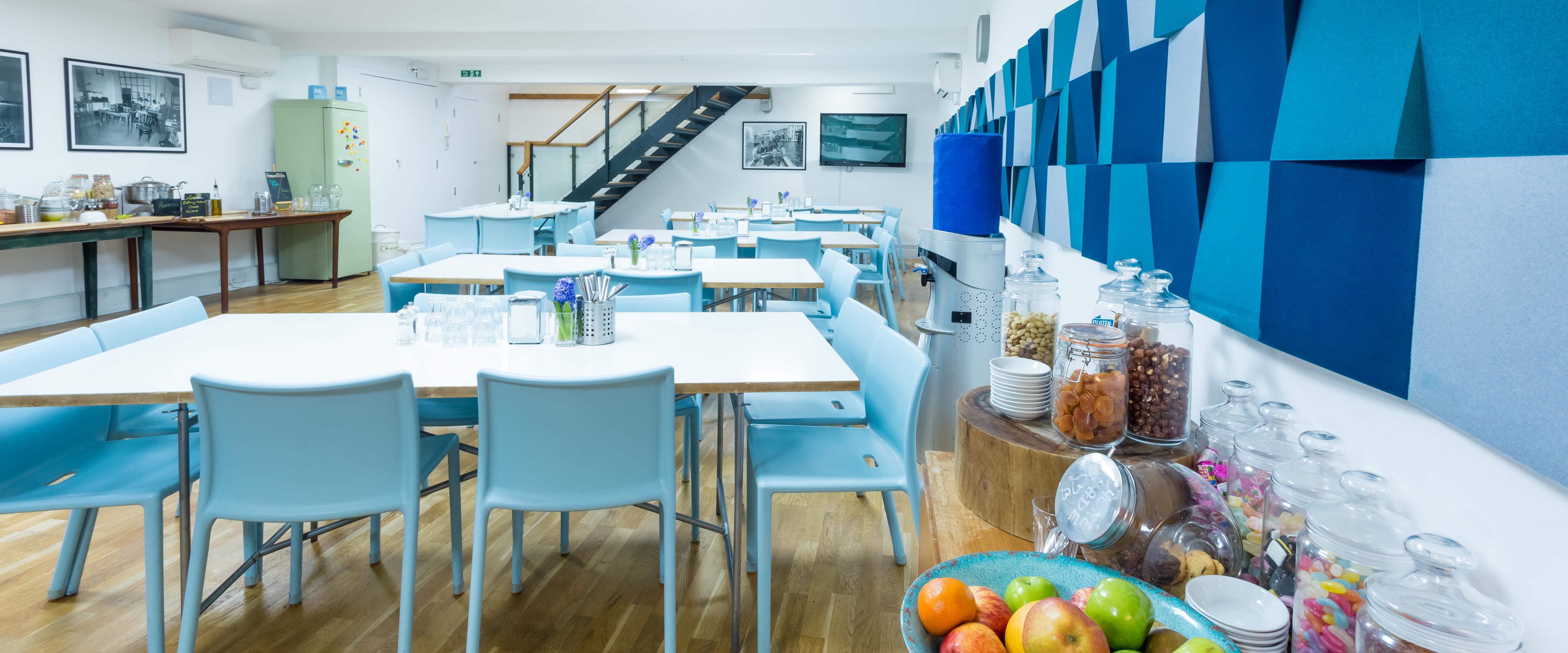 Modern meeting space at Wallacespace Covent Garden with light blue chairs for collaboration.