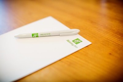 Carrington meeting setup at Holiday Inn High Wycombe with branded stationery and pen.