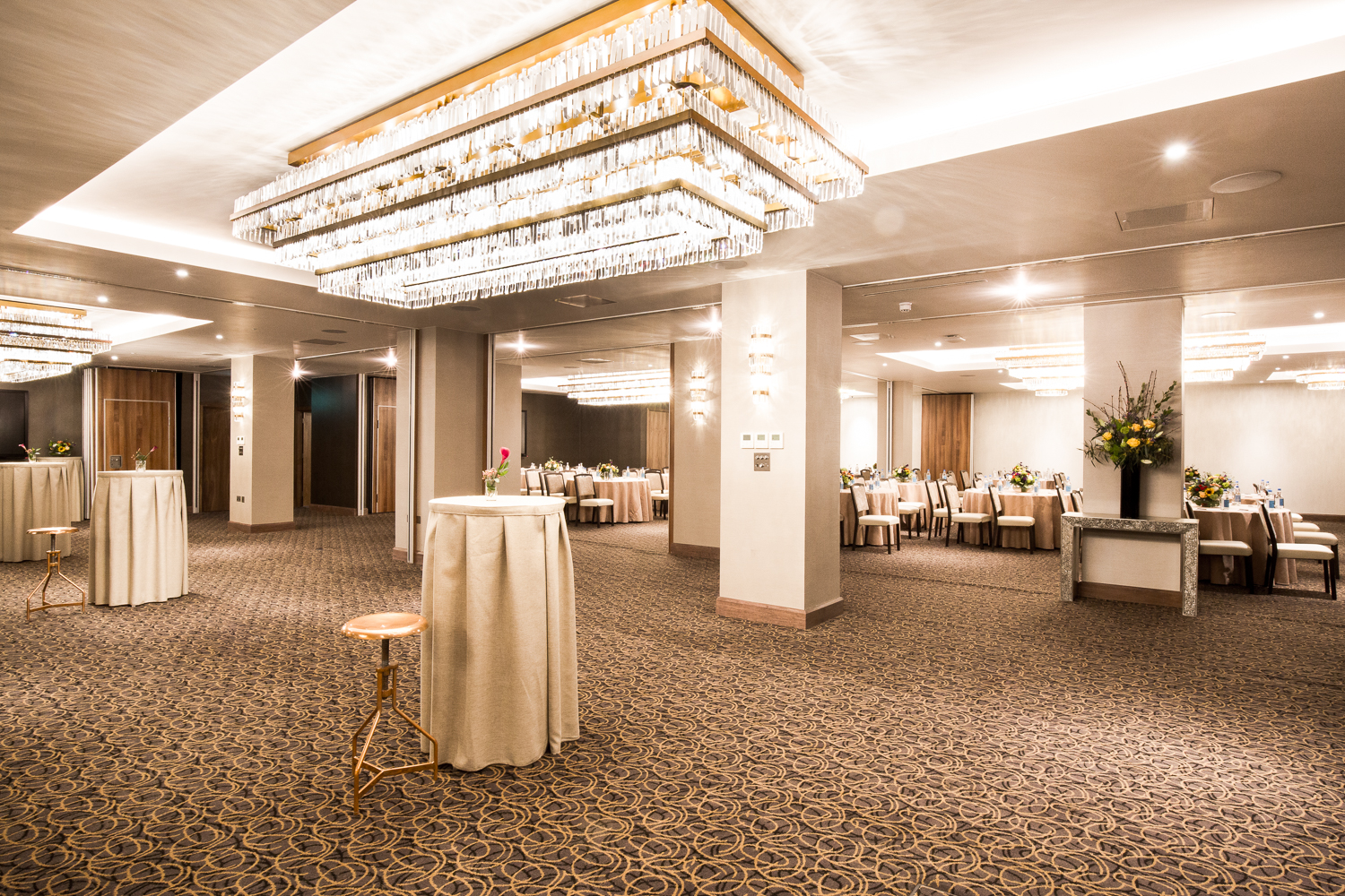 Royal London Suite with elegant chandeliers, perfect for networking events and receptions.