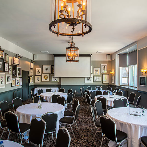 Dulwich Suite meeting room with elegant round tables for corporate events and social functions.