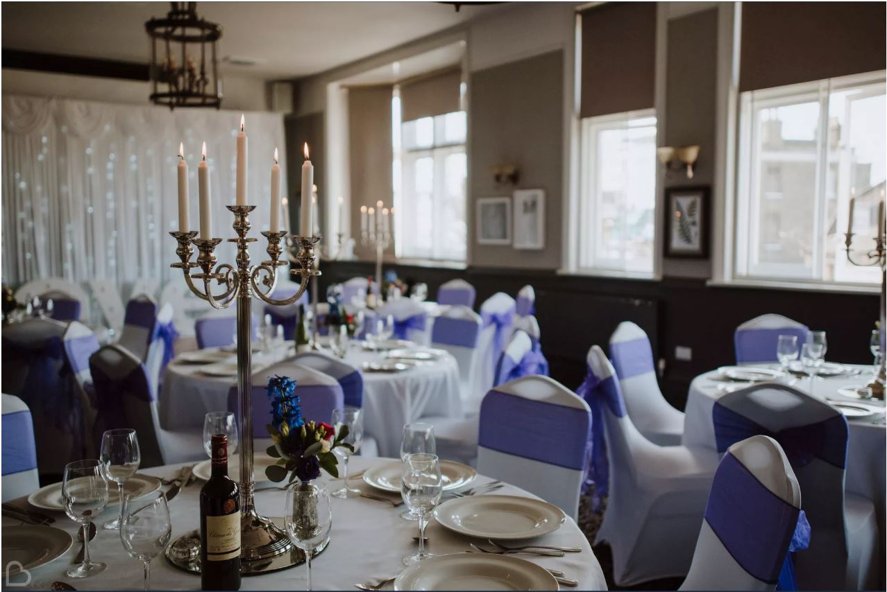 Elegant Dulwich Suite banquet room with candelabra for upscale weddings and events.
