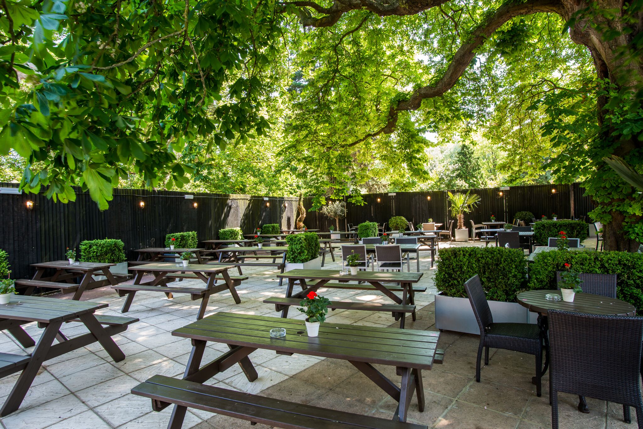 Garden at The Crown and Greyhound, outdoor venue for events with picnic tables, meeting space.