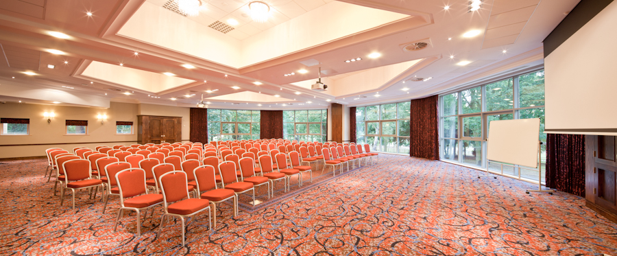 Park View Suite at Drayton Manor Hotel, bright conference room with orange chairs for events.