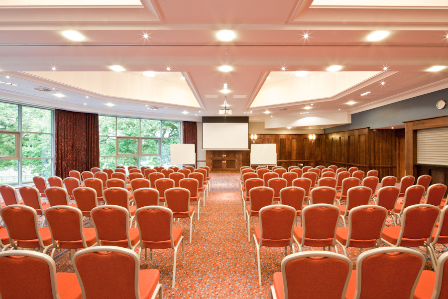 Park View Suite conference room with red chairs, ideal for seminars and workshops.