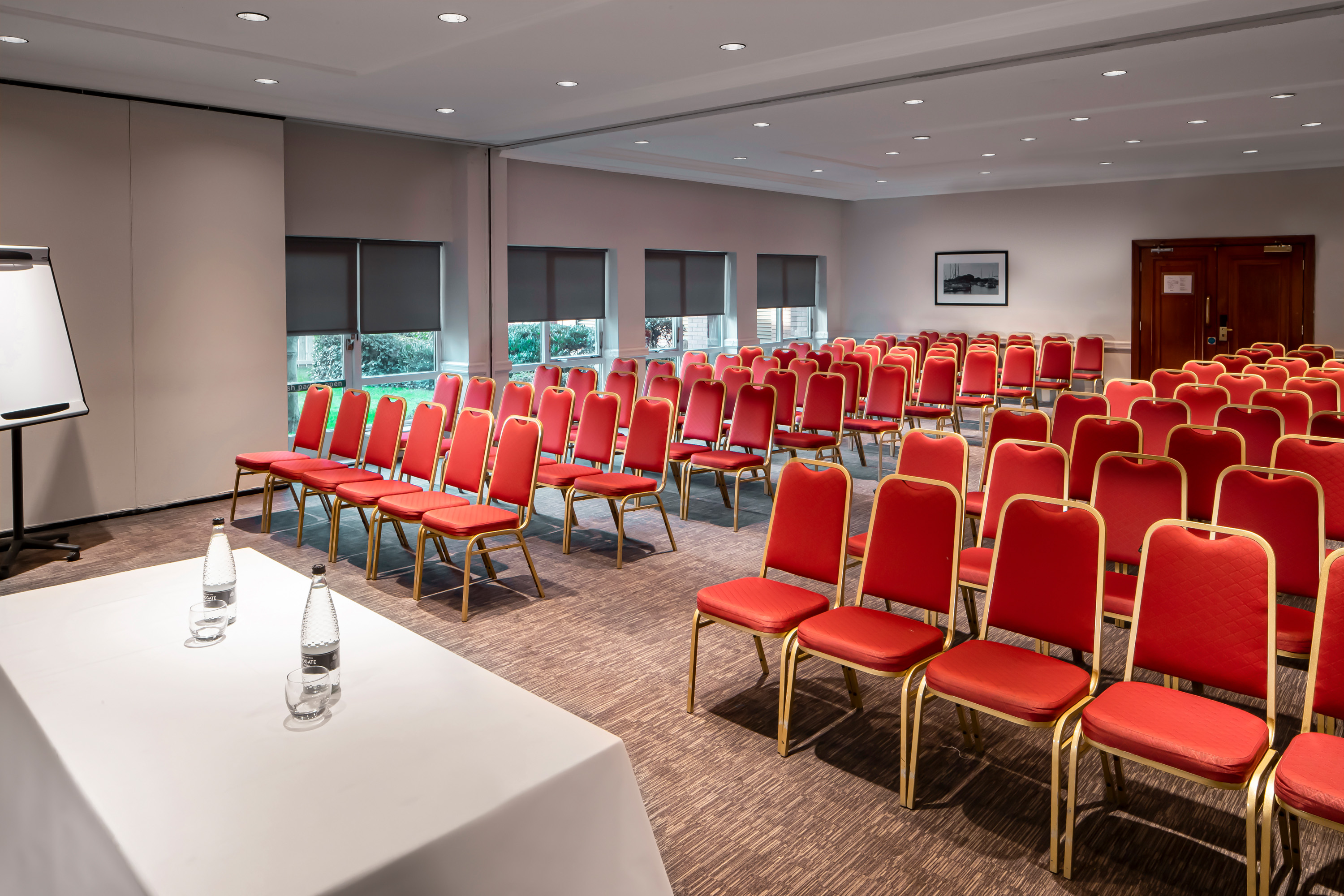 Myton Suite meeting room with red chairs, ideal for presentations and workshops.