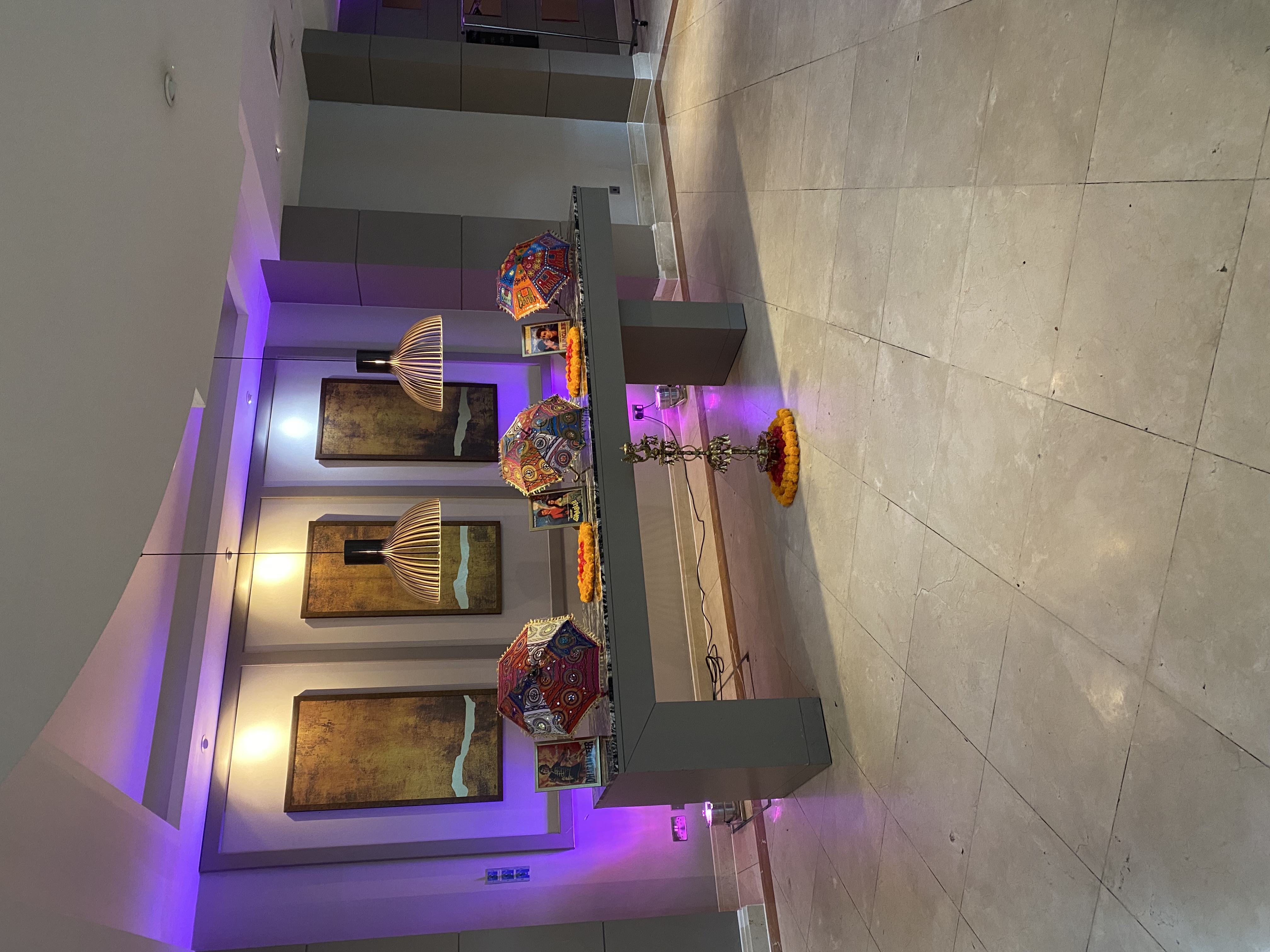 Ivy Suite event setup with vibrant umbrellas and floral decor at The Crown London Hotel.