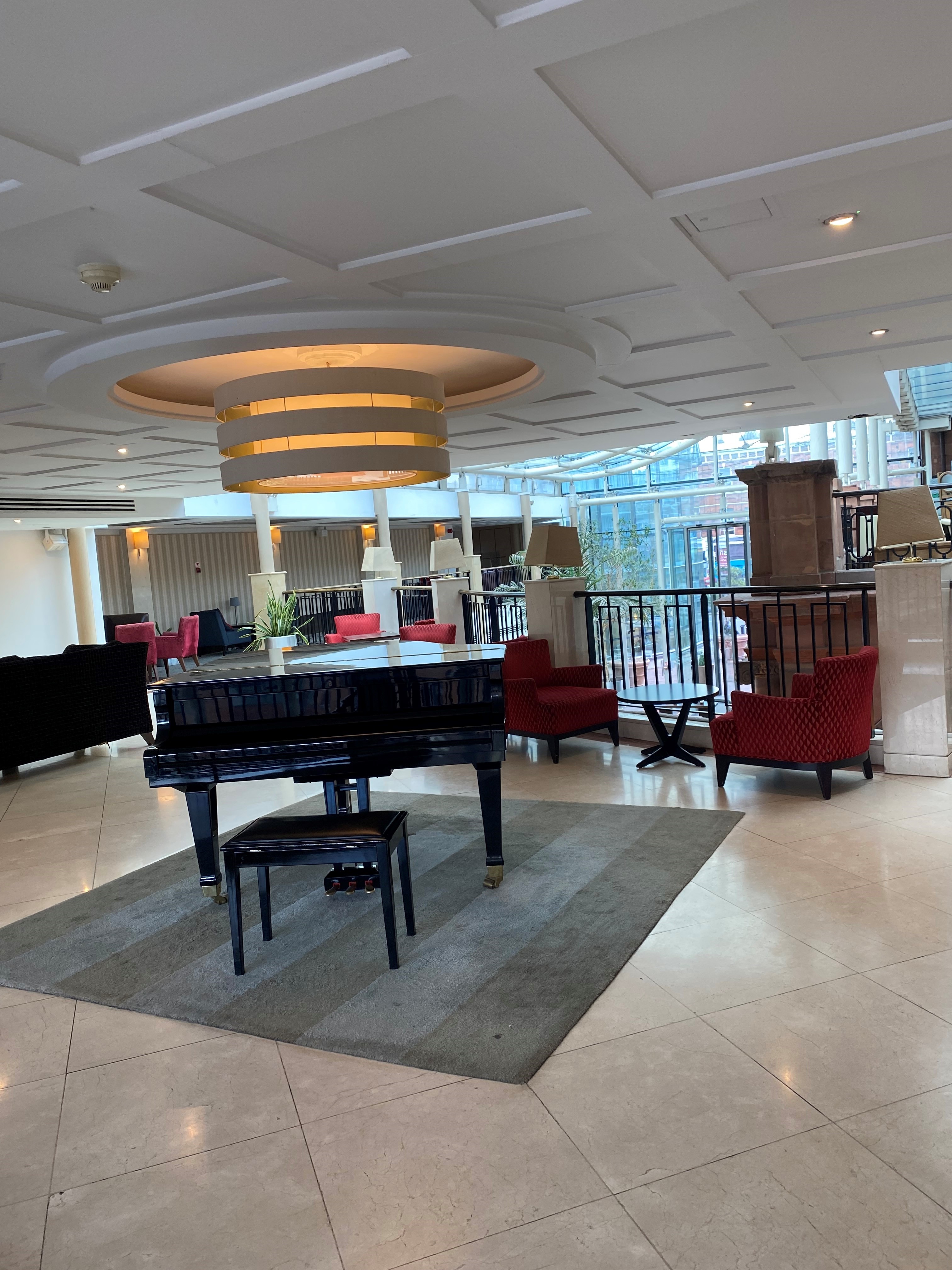 Sala Room at The Crown London Hotel with grand piano, ideal for networking events.