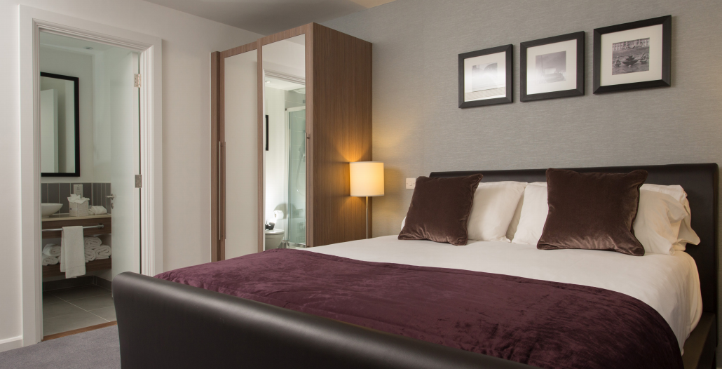 Staybridge Suites Birmingham hotel room with modern decor, ideal for conferences and events.