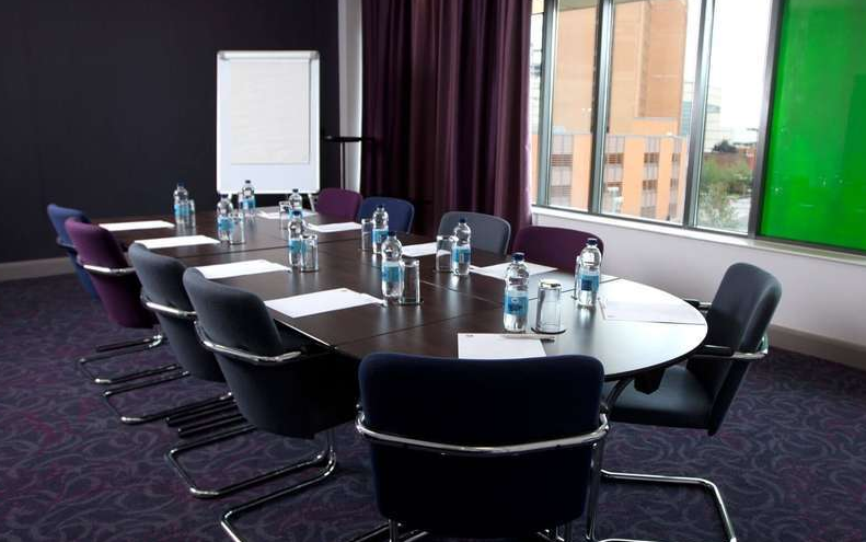 Meeting Room 7 at Clayton Hotel Cardiff with oval table, ideal for professional events.