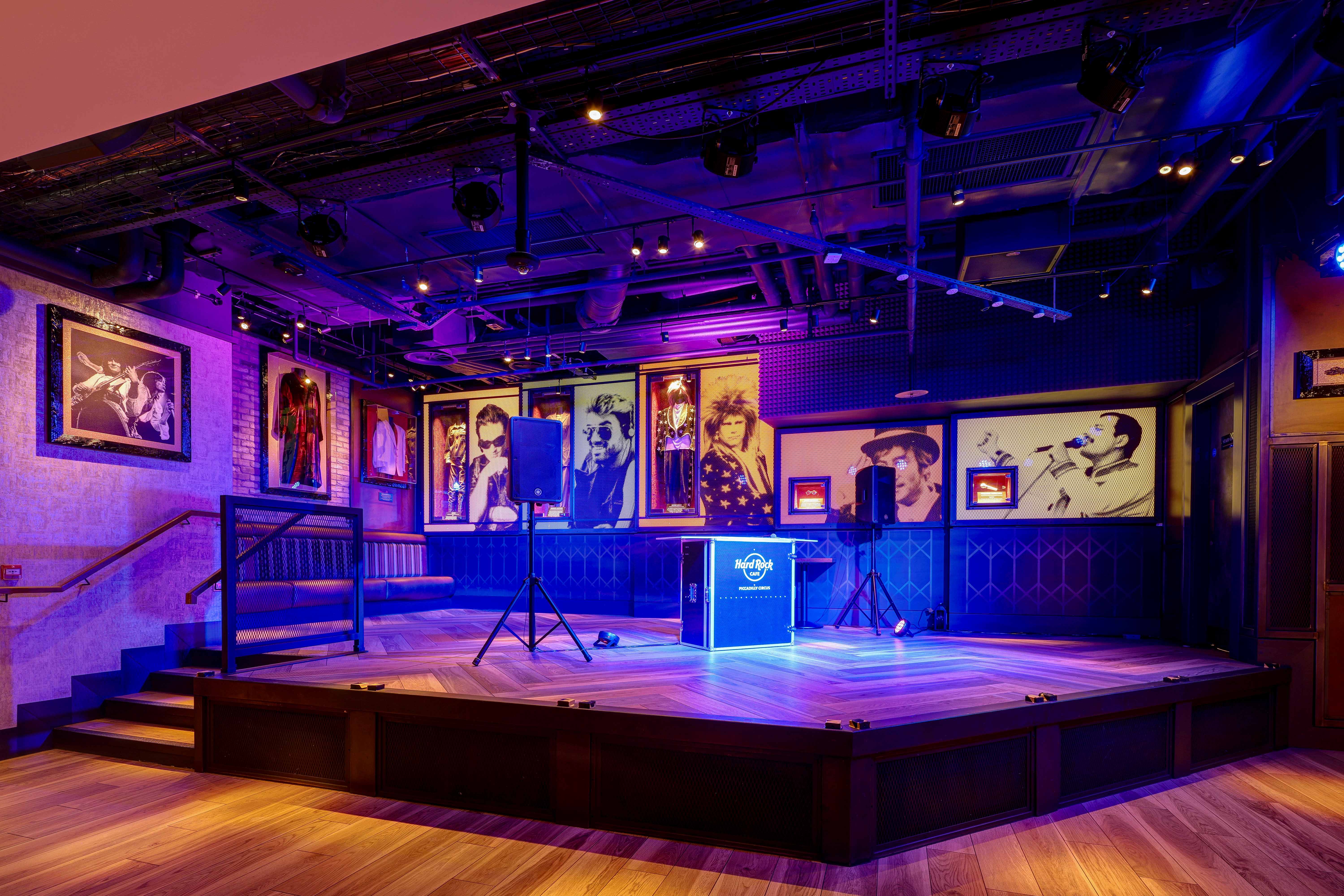 Vibrant event space at Hard Rock Cafe Piccadilly Circus with polished wooden stage.
