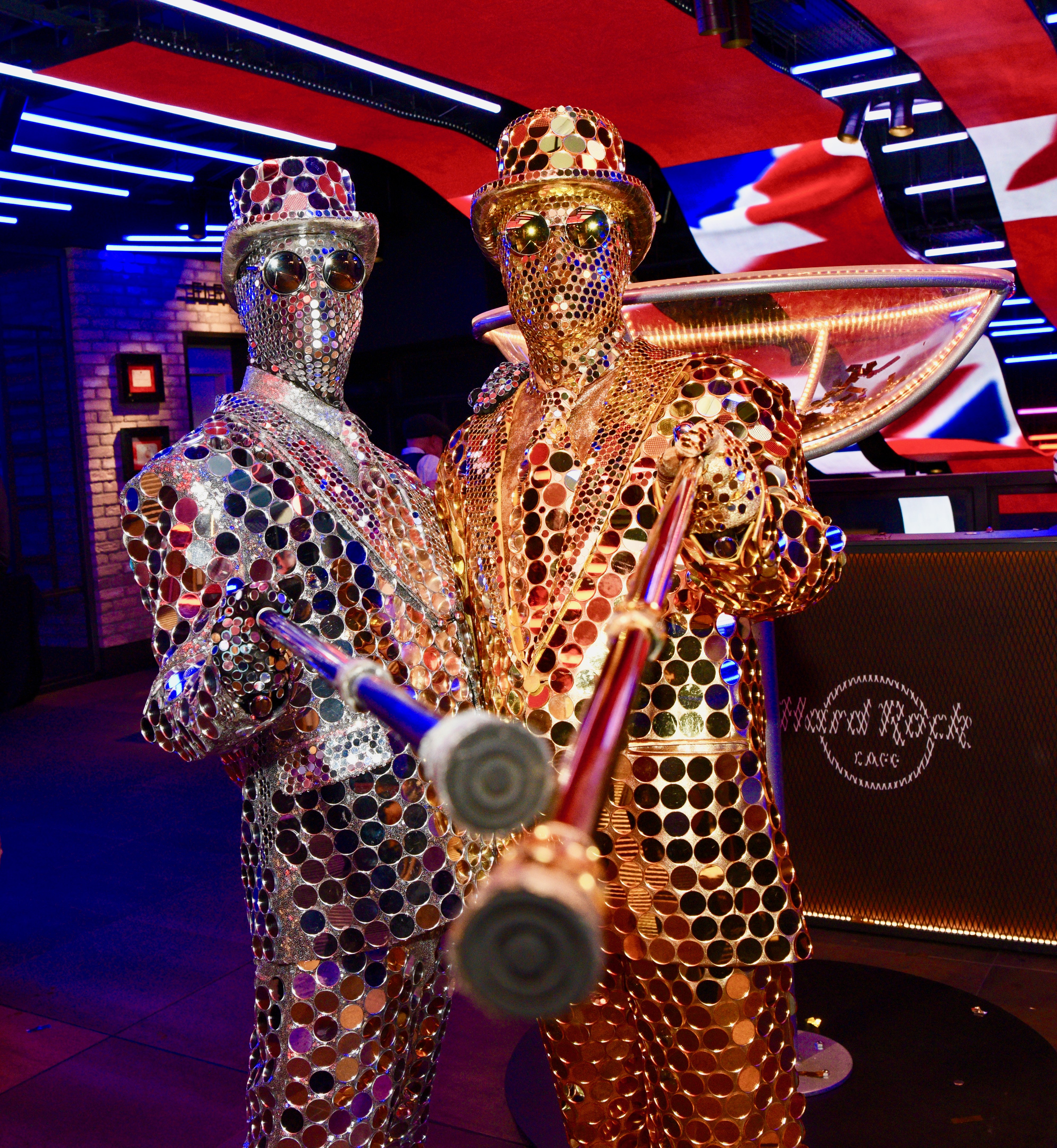 Performers in dazzling costumes at Hard Rock Cafe Piccadilly Circus event.