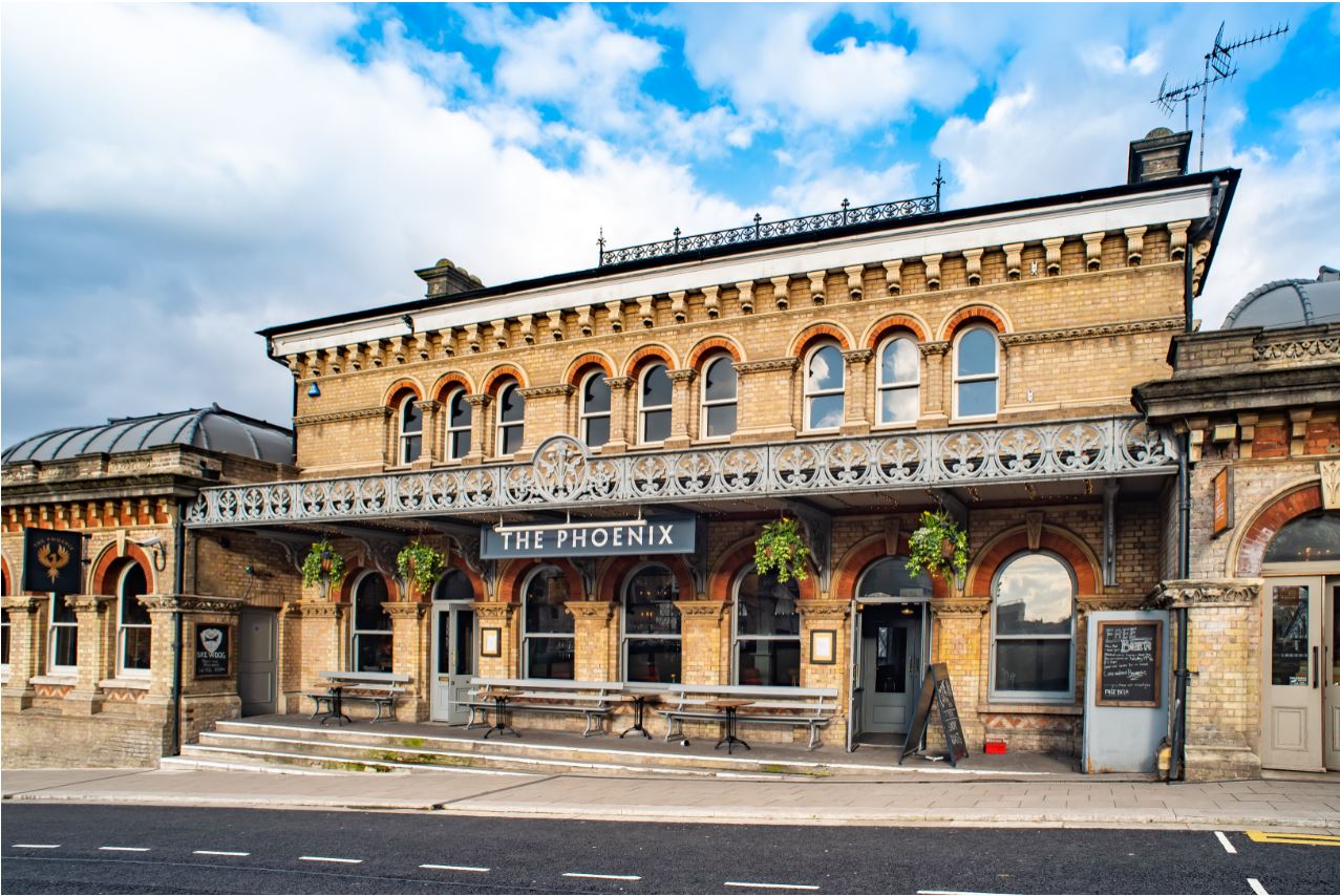 Charming venue The Phoenix, Denmark Hill, perfect for events with outdoor seating.