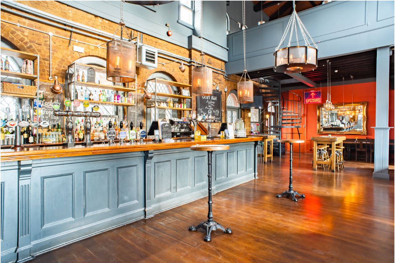 Stylish bar area at Exclusive Hire, perfect for networking events and social gatherings.