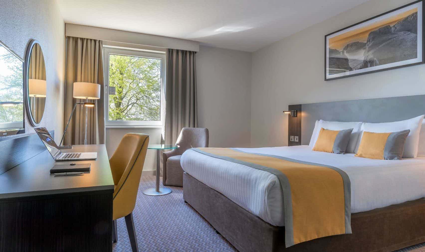 Island Suite at Maldron Hotel: modern design, comfortable bed, ideal for business events.