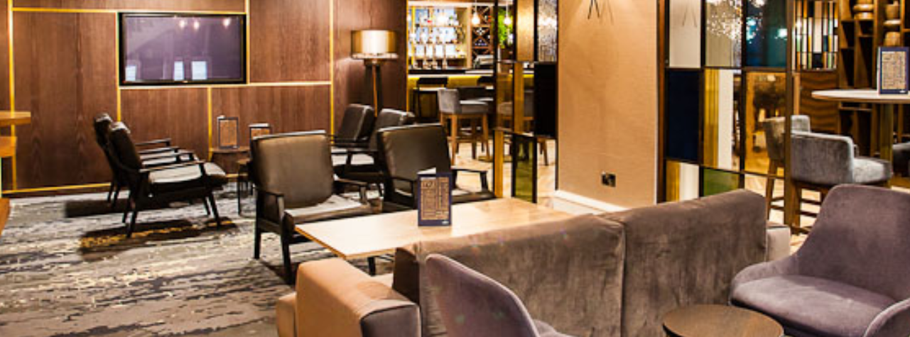 Stylish lounge at Crowne Plaza Leeds, ideal for networking events and informal meetings.