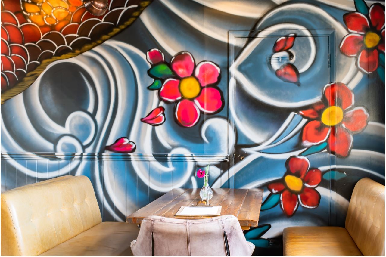 Vibrant floral mural in The Mezzanine, ideal for creative meetings and social events.
