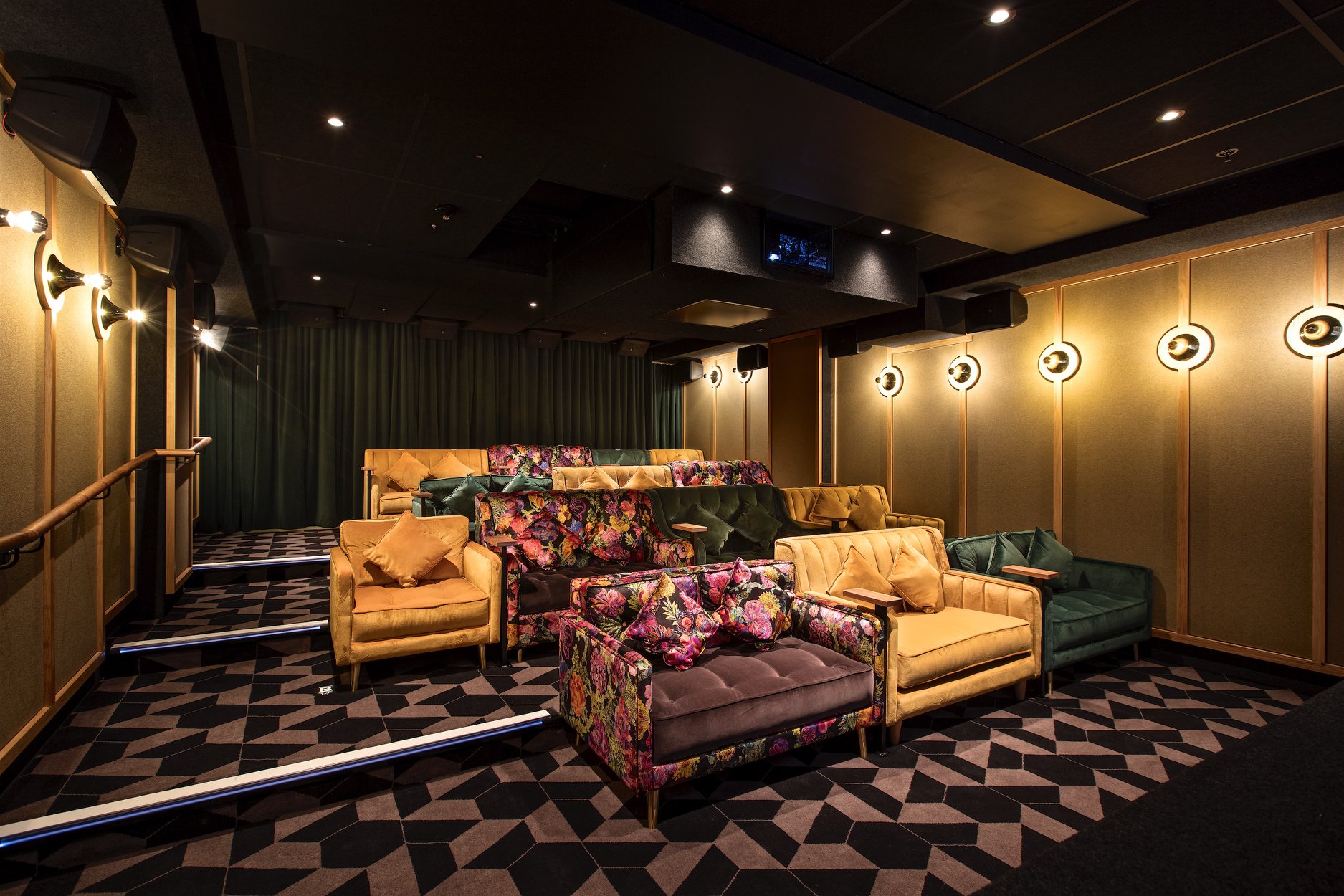 Stylish screening room with plush seating for private film screenings and corporate events.