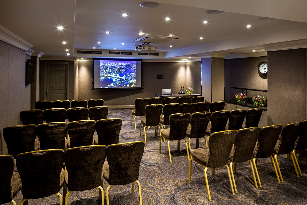 Private Room 11 at Radisson Blu, London: elegant meeting space with theater seating.