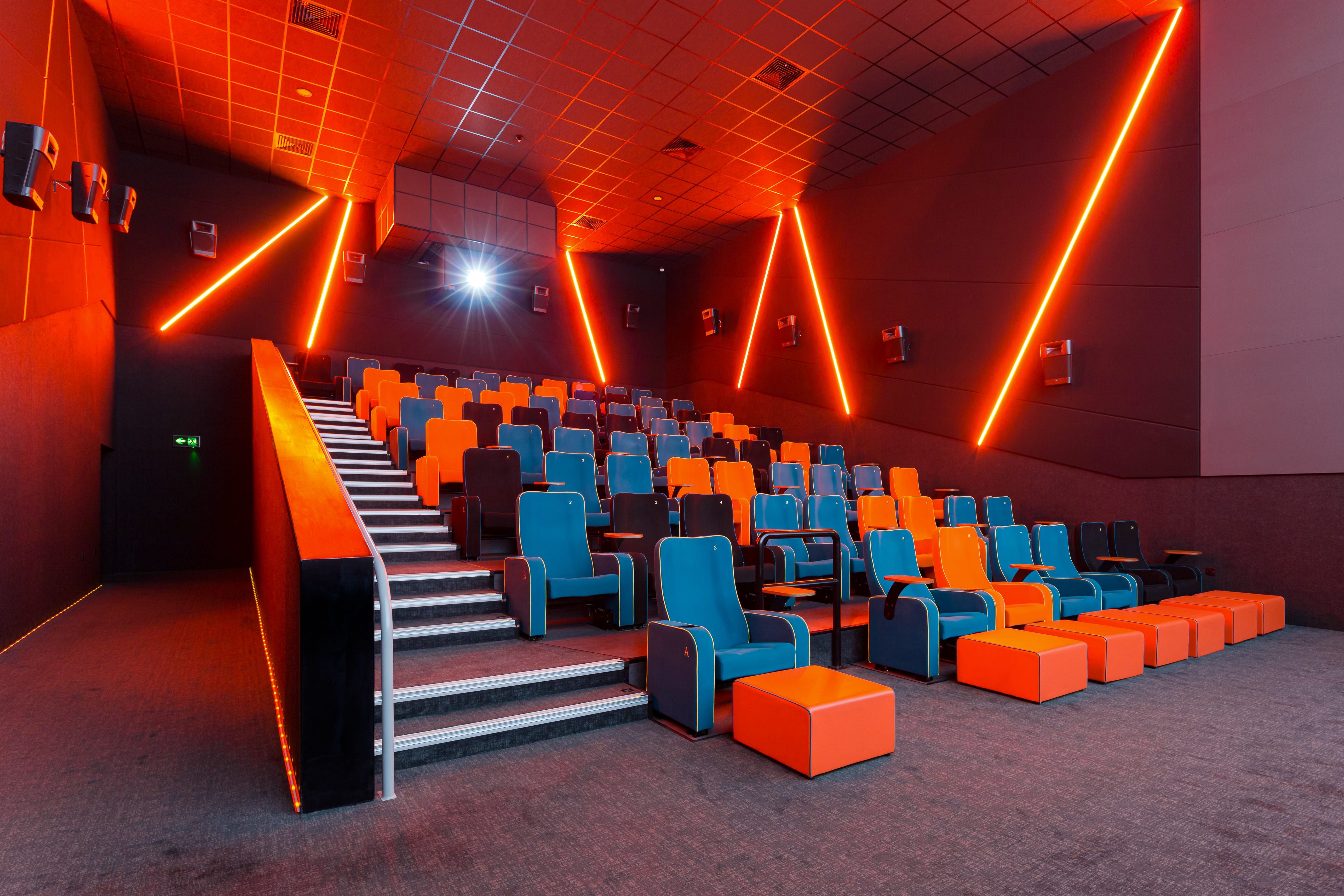 Modern cinema auditorium with vibrant seating for film screenings and corporate events.