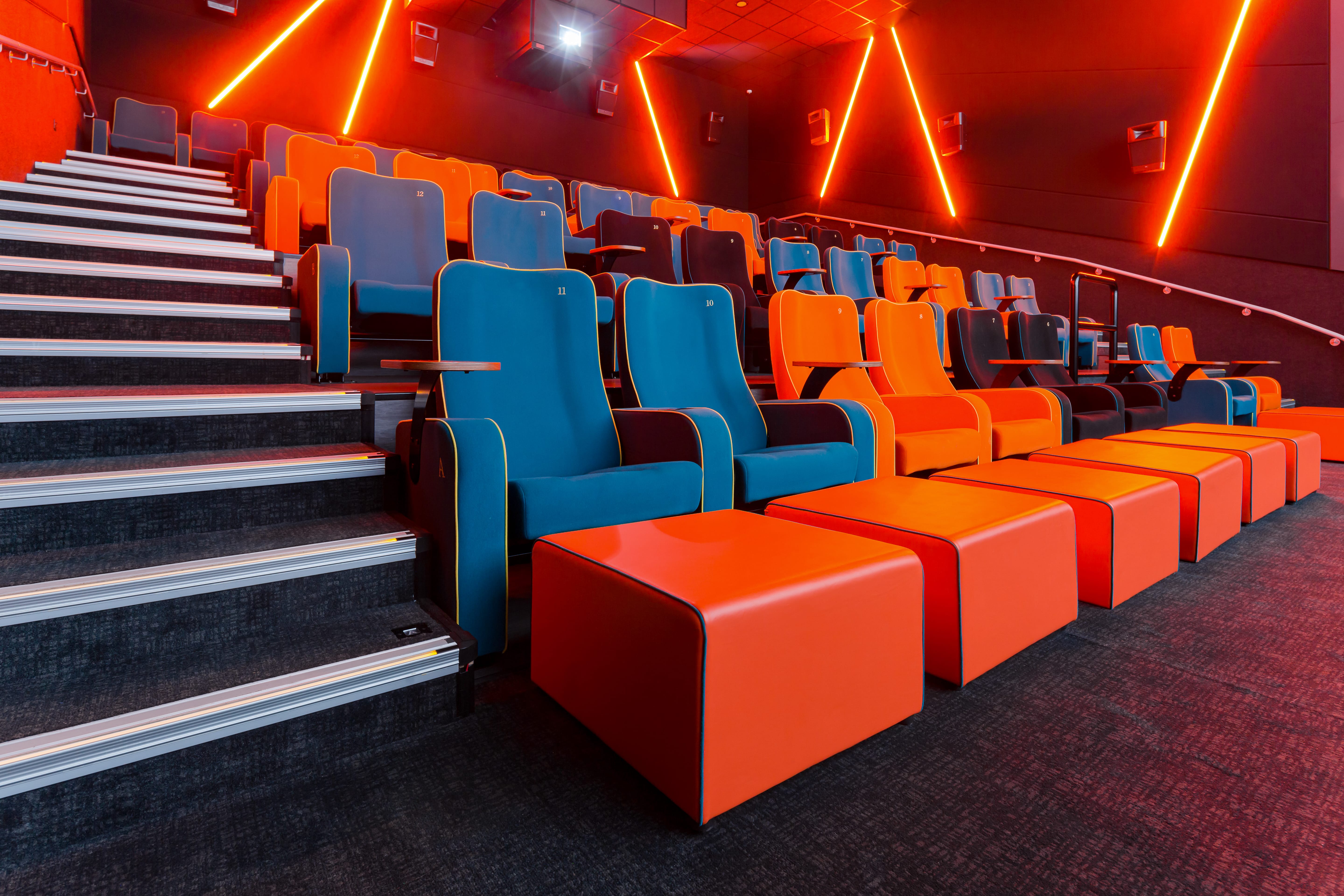 Modern auditorium with vibrant seating in The Light Cinema Stockport for film screenings.