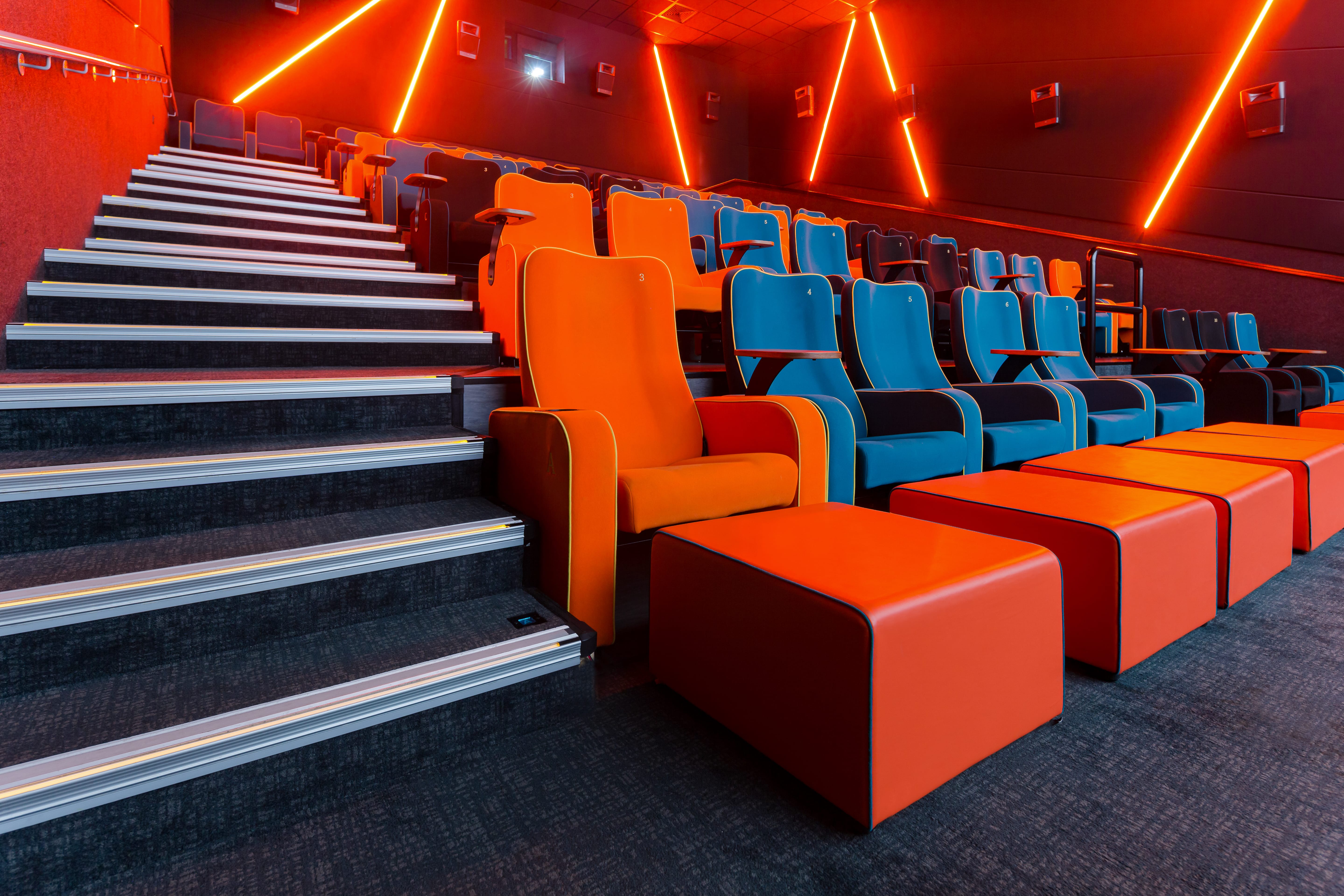 Modern cinema auditorium with tiered seating, ideal for film screenings and presentations.