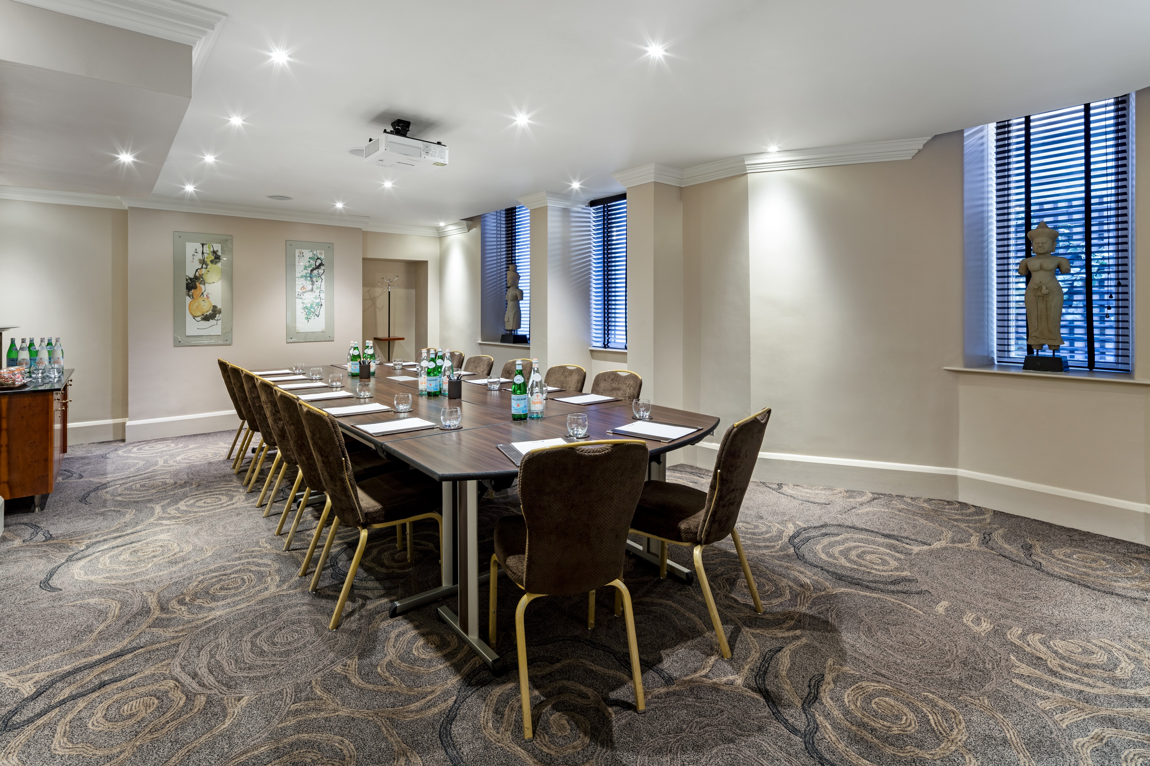 Private Room 14 at Radisson Blu, elegant meeting space with long table for professional events.
