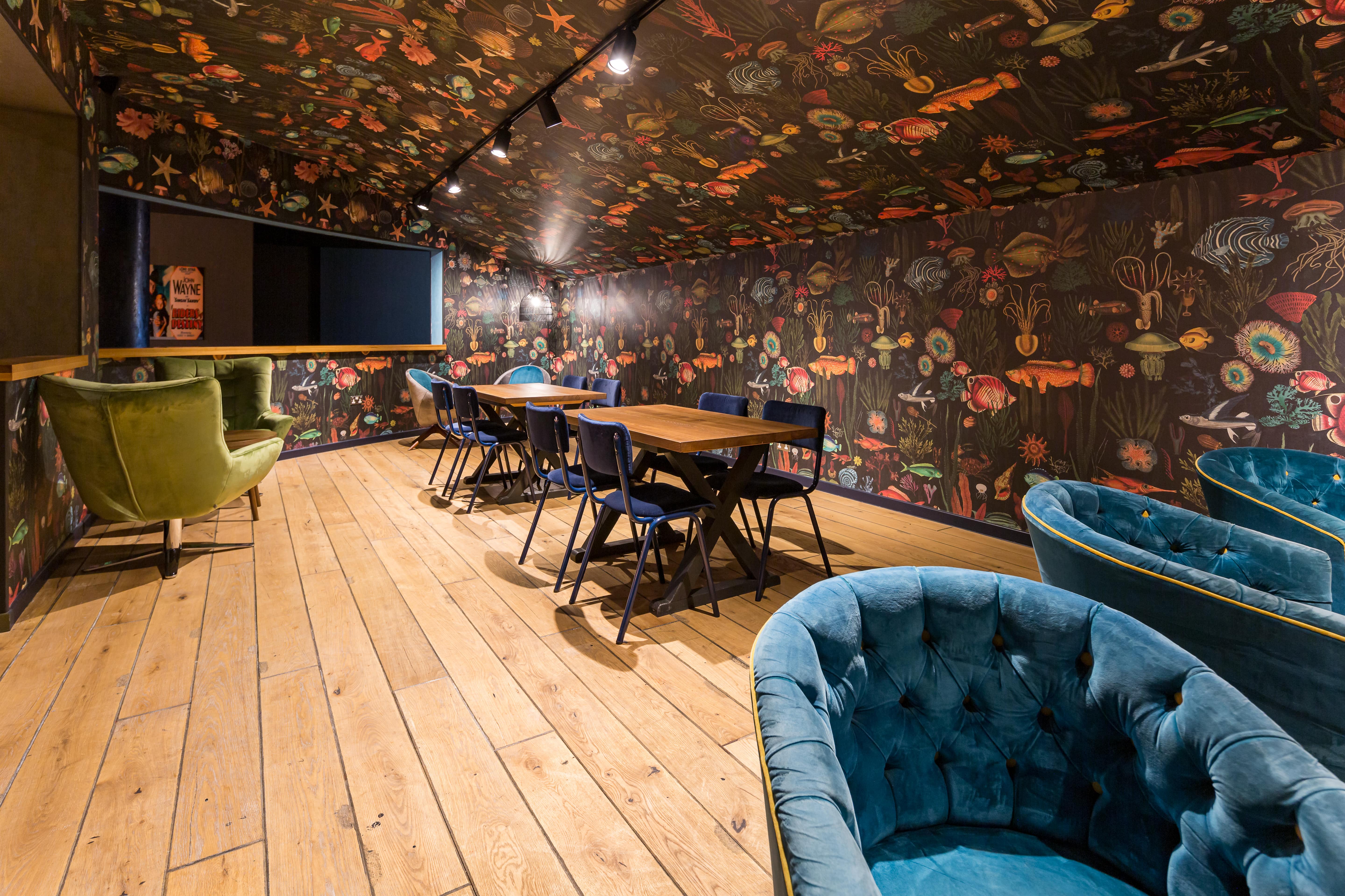 Atlantis Room at The Light Cinema Stockport, vibrant floral decor for creative meetings.