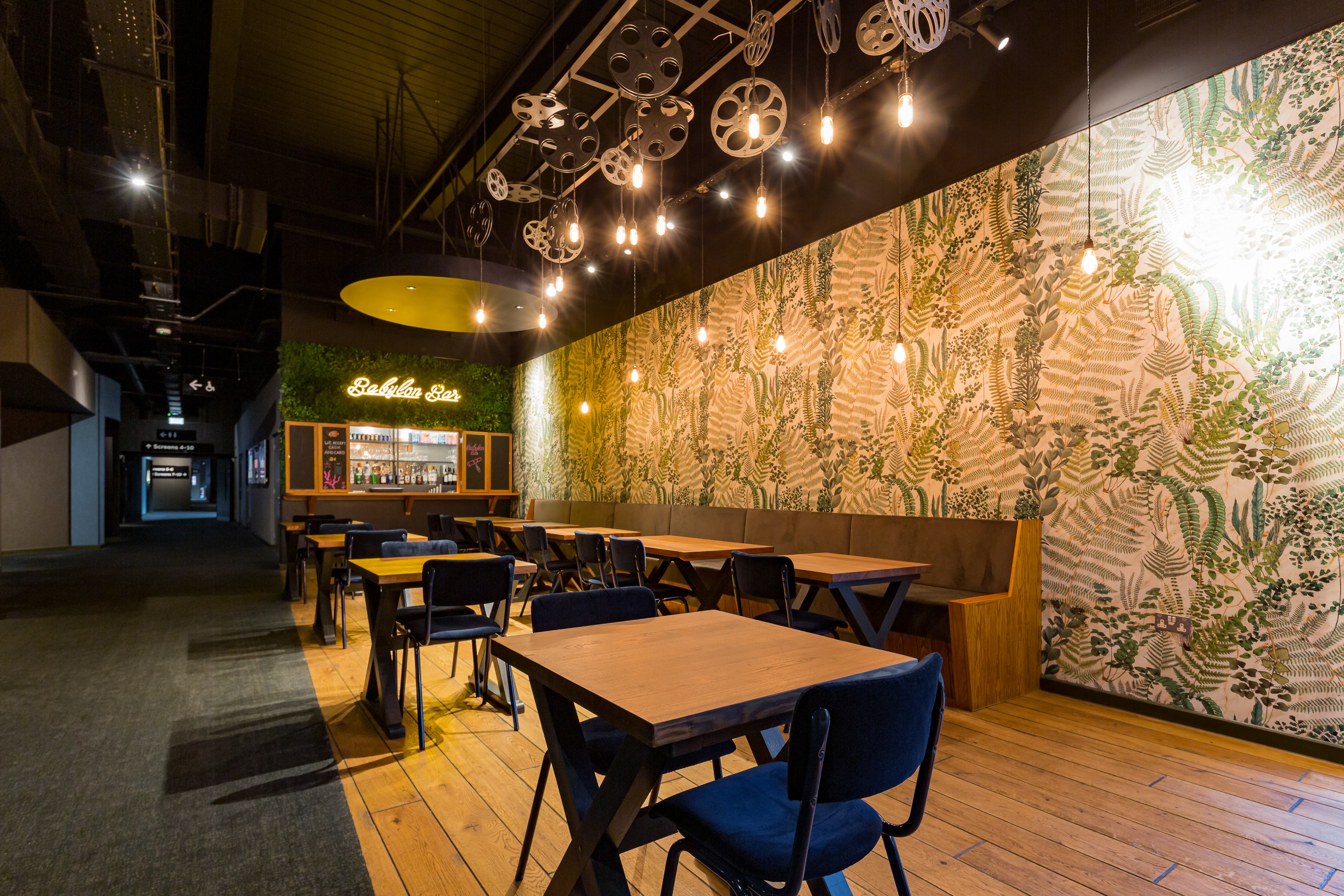 Stylish Babylon Bar event space with greenery and industrial accents in Stockport.