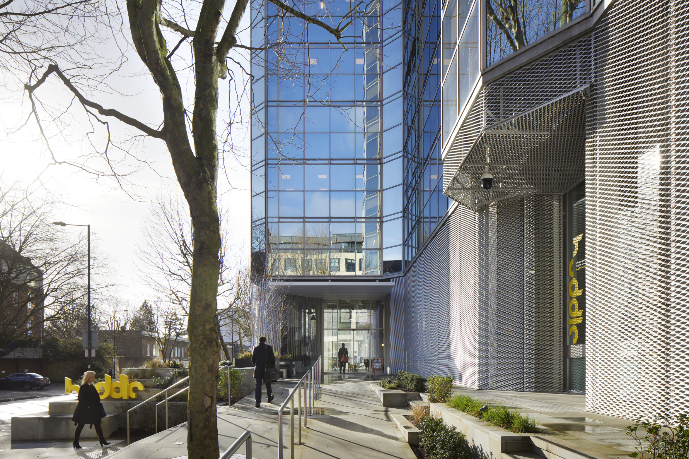 Modern glass entrance of Huddle venue, perfect for professional meetings and events.