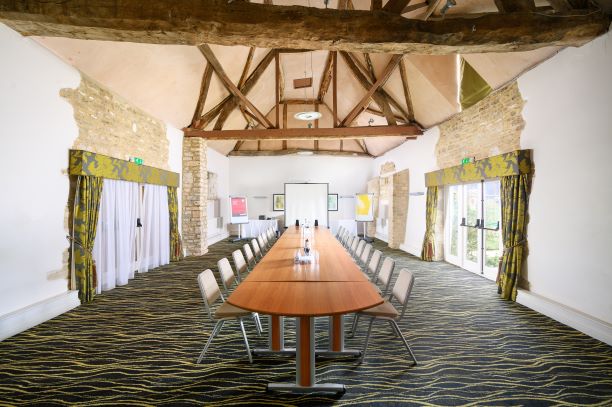 Spacious meeting room at Little Barn, voco™ Oxford Thames Hotel, ideal for workshops.