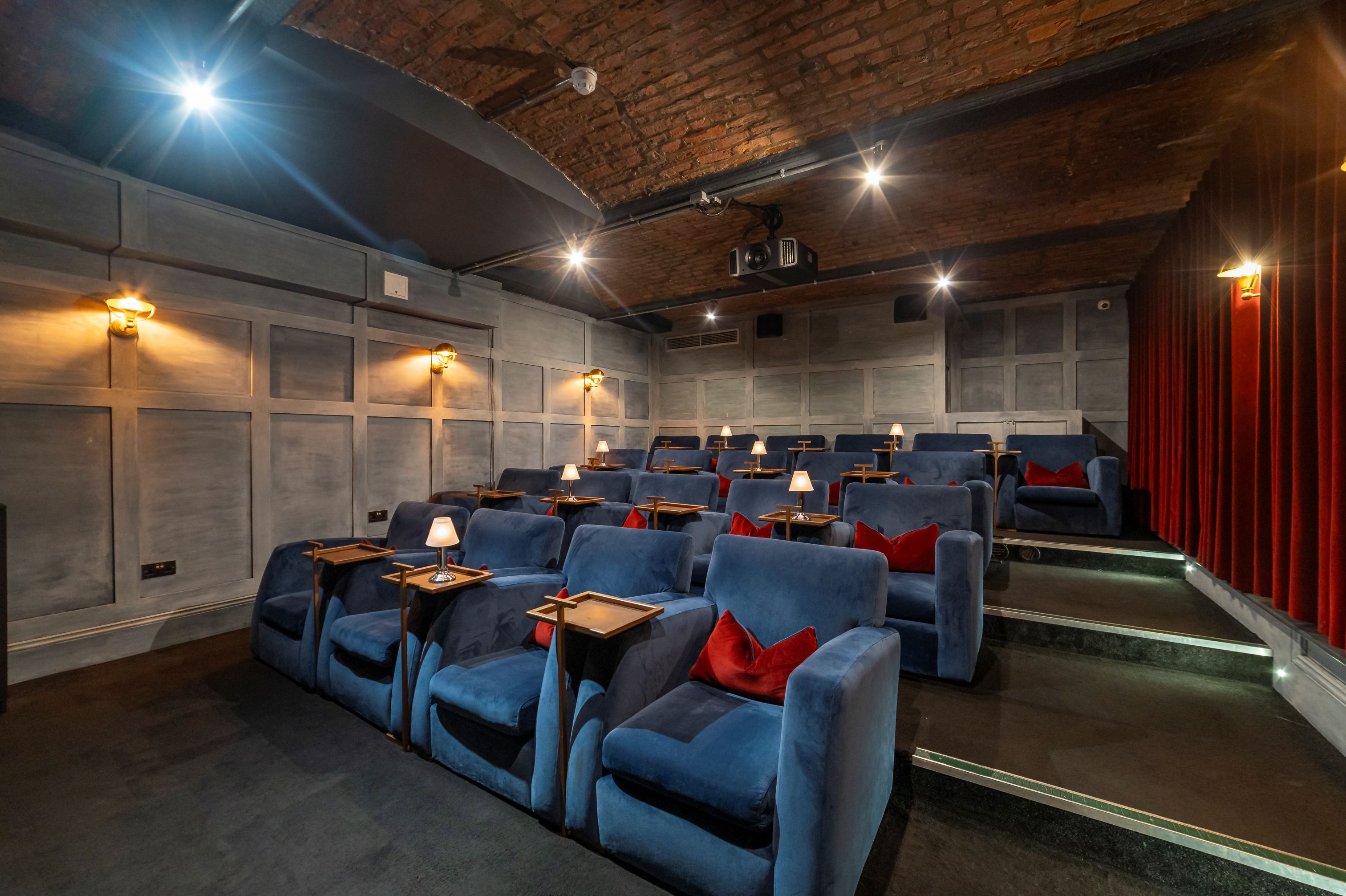 Stylish screening room with plush seating for private events and film screenings.