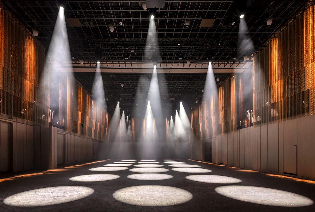 Ballroom at The Londoner with dramatic lighting, ideal for conferences and galas.