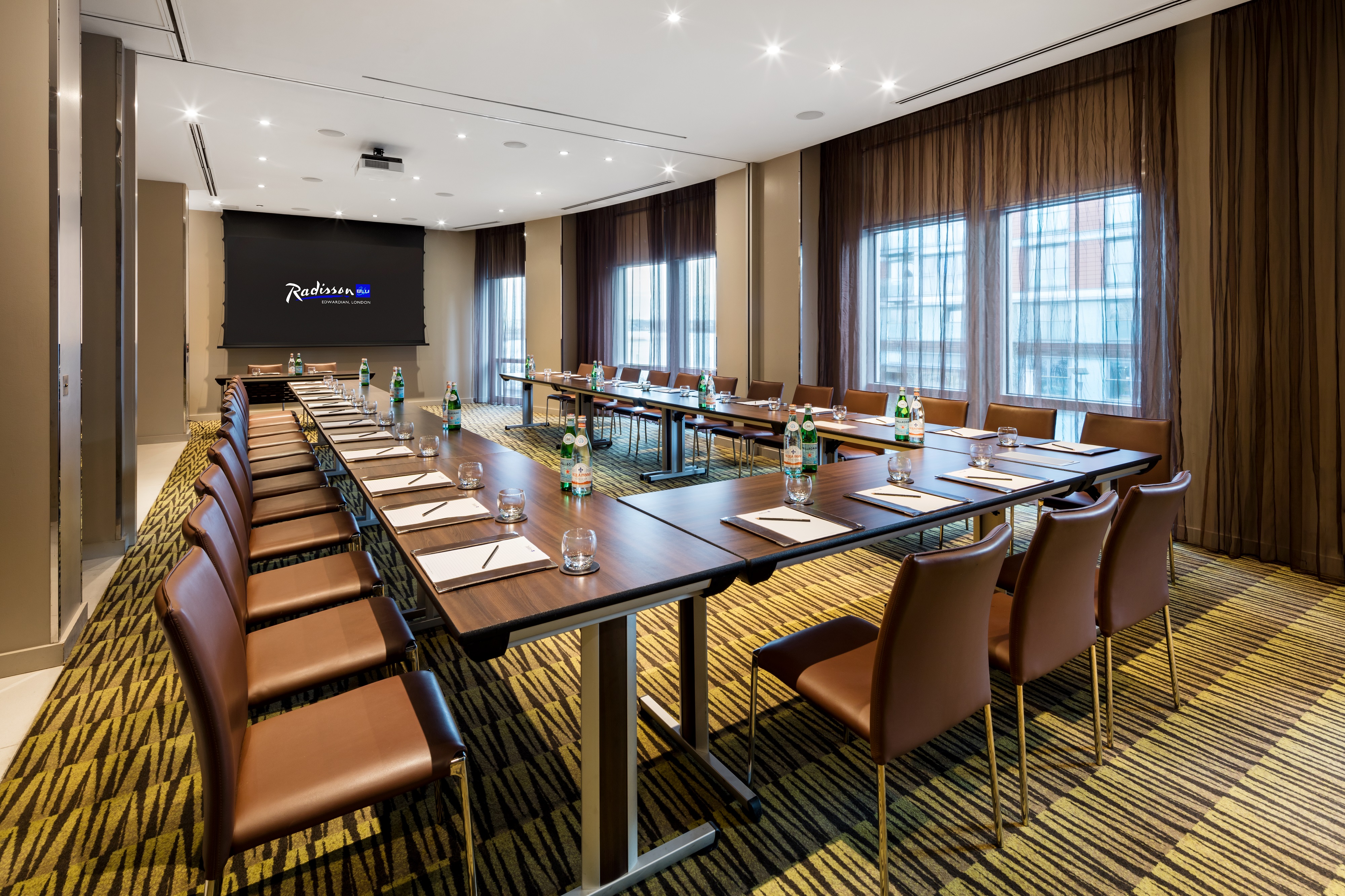 Private meeting room with natural light at Radisson Blu Edwardian for professional events.