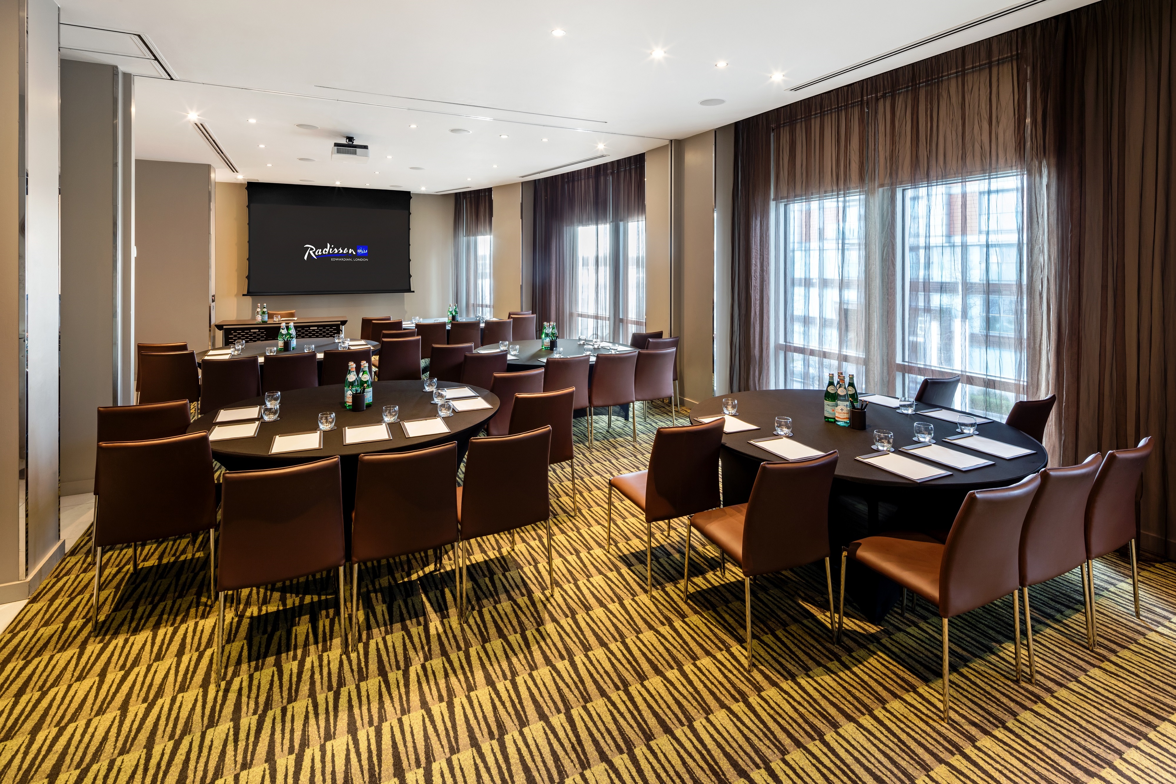 Private meeting room with U-shaped seating at Radisson Blu Edwardian, ideal for events.