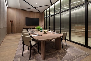 Modern meeting room at Tate Britain, featuring a sleek wooden table for corporate events.