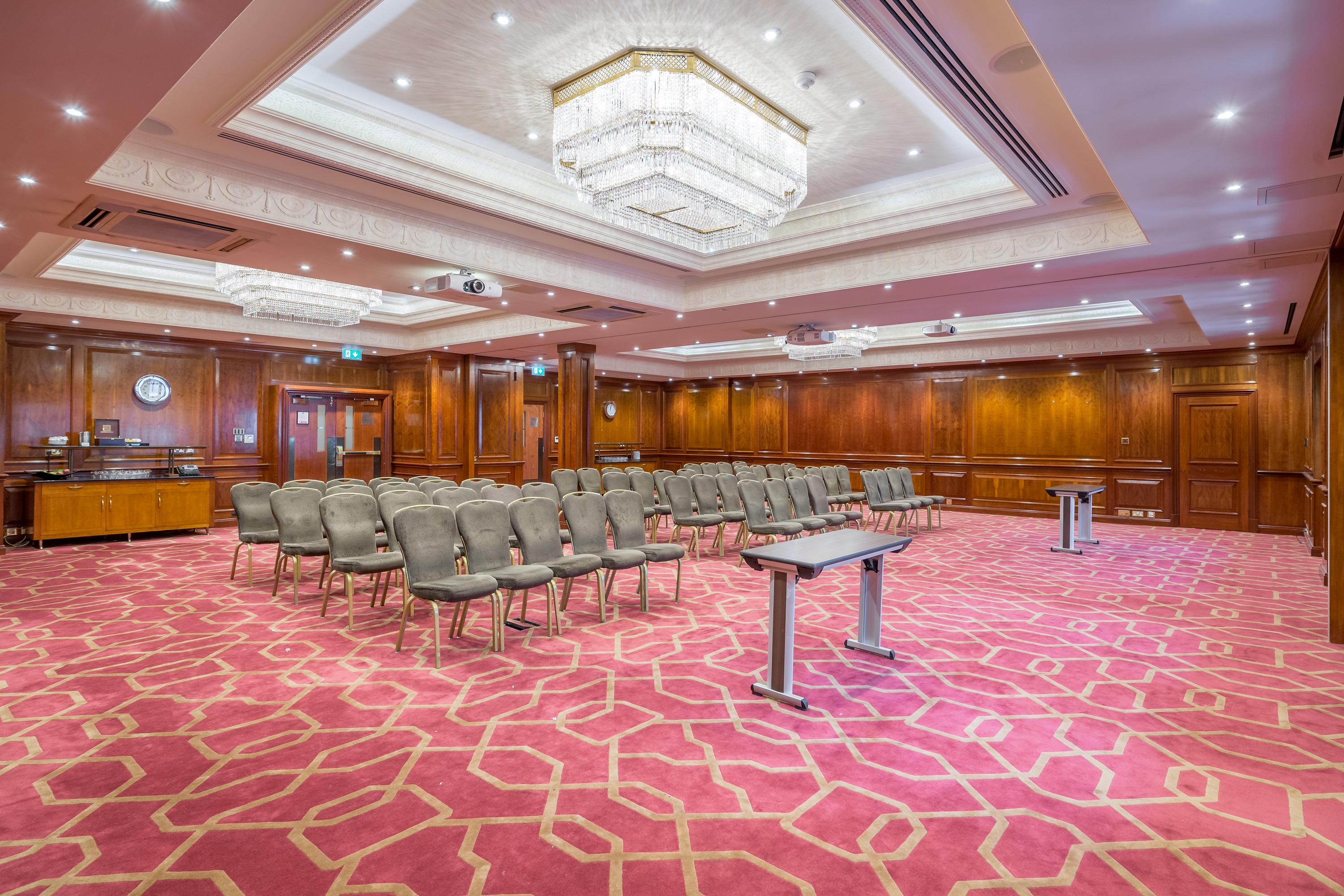 Elegant meeting room at Radisson Blu Heathrow with chandelier, ideal for corporate events.