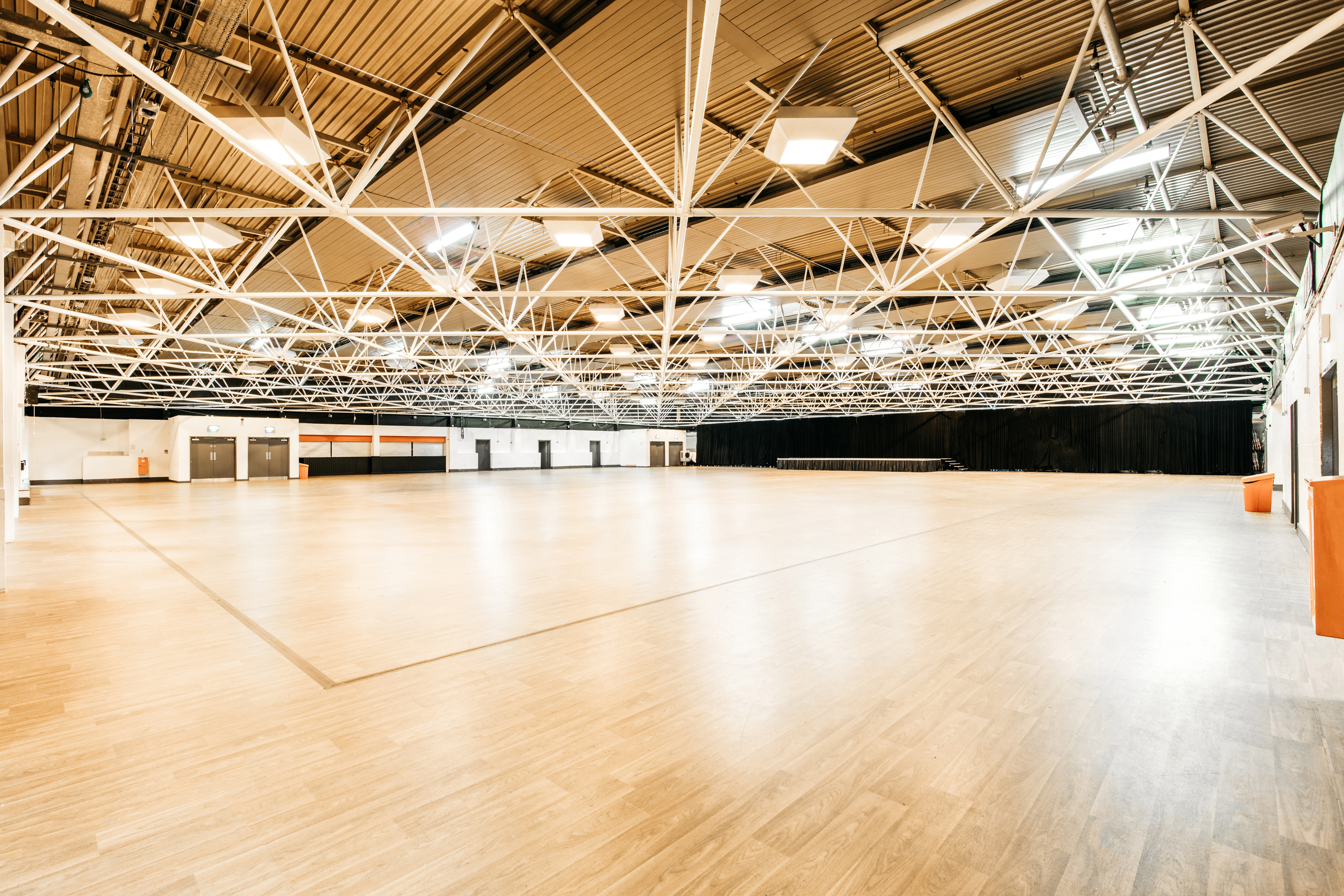 Spacious Byron Hall venue with high ceilings for conferences and exhibitions.