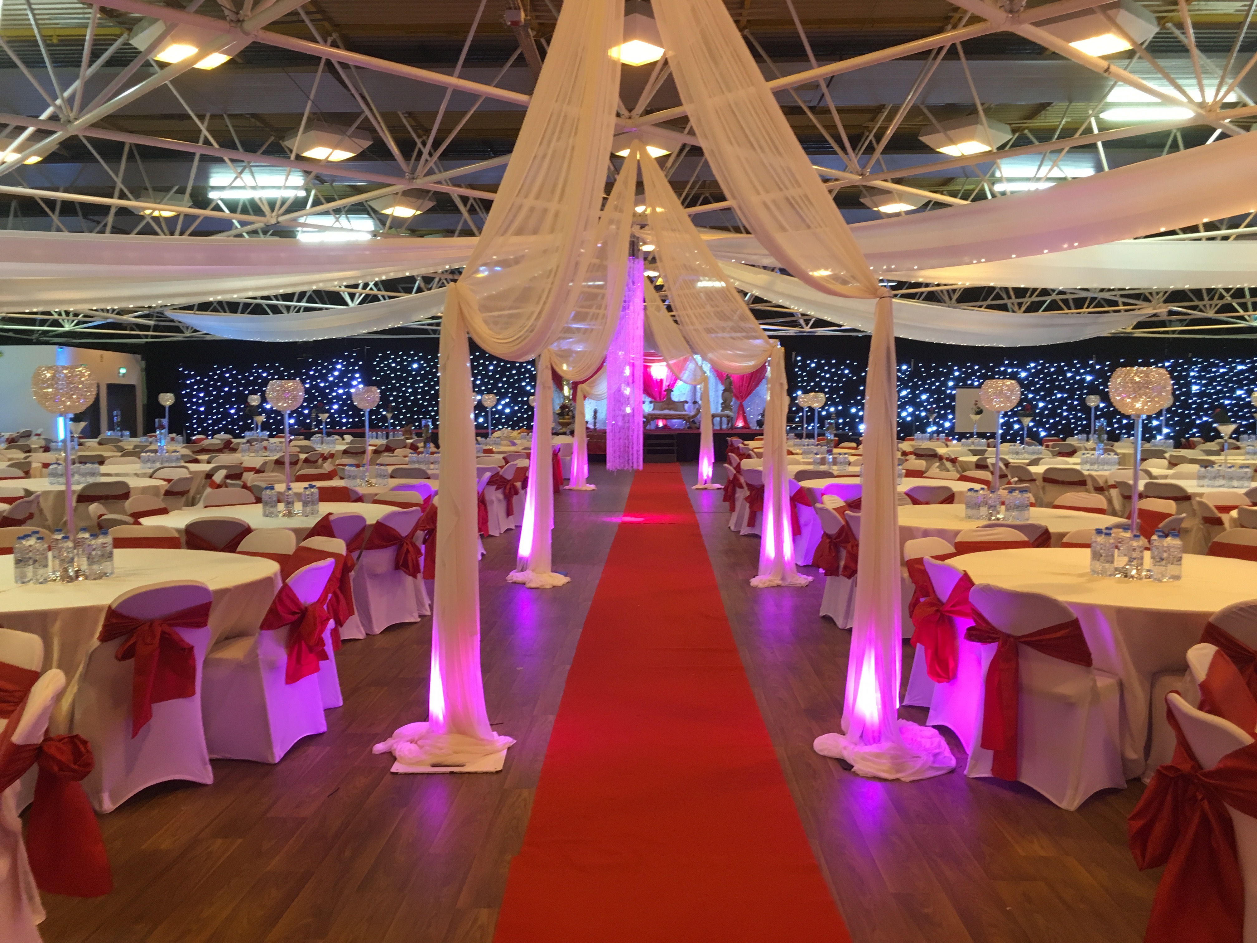 Elegant event space in Byron Hall with red carpet, ideal for weddings and formal gatherings.